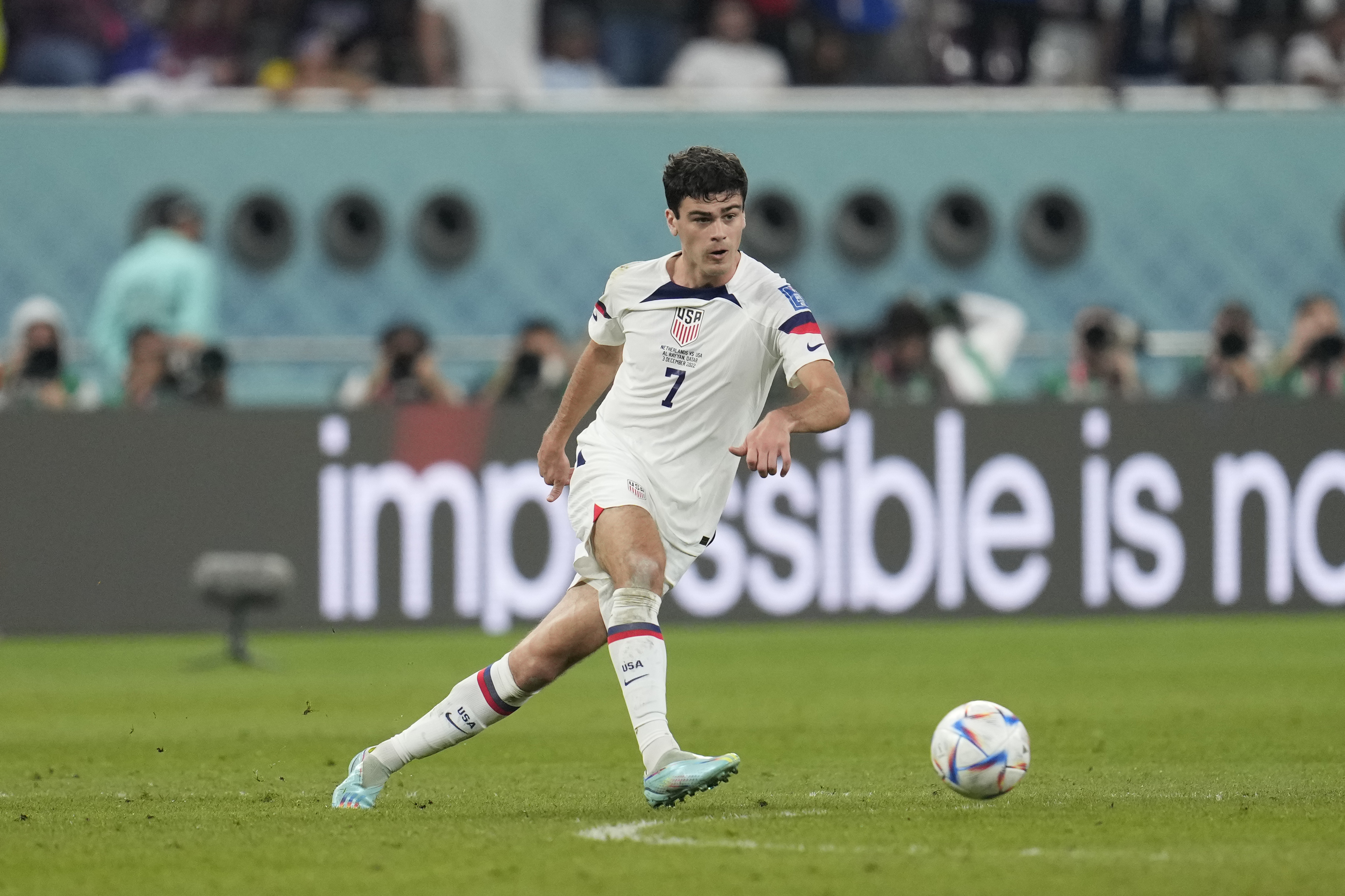 FILE - Gio Reyna of the United States kicks the ball during the World Cup round of 16 soccer match between the Netherlands and the United States, at the Khalifa International Stadium in Doha, Qatar, Saturday, Dec. 3, 2022. Former United States coach Jurgen Klinsmann says the fallout from the public dispute between coach Gregg Berhalter and the family of young star Reyna is “obviously not looking good” for U.S. soccer. Klinsmann, who coached the men’s national team from 2011-2016, said Wednesday, Jan. 18, 2023, he felt the problems between Berhalter and Reyna may have played a role in the team’s underwhelming performance at the World Cup in Qatar. 