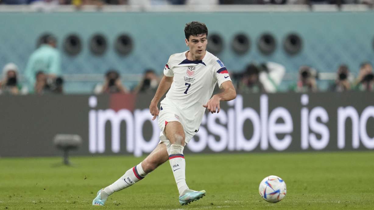 FILE - Gio Reyna of the United States kicks the ball during the World Cup round of 16 soccer match between the Netherlands and the United States, at the Khalifa International Stadium in Doha, Qatar, Saturday, Dec. 3, 2022. Former United States coach Jurgen Klinsmann says the fallout from the public dispute between coach Gregg Berhalter and the family of young star Reyna is “obviously not looking good” for U.S. soccer. Klinsmann, who coached the men’s national team from 2011-2016, said Wednesday, Jan. 18, 2023, he felt the problems between Berhalter and Reyna may have played a role in the team’s underwhelming performance at the World Cup in Qatar.
