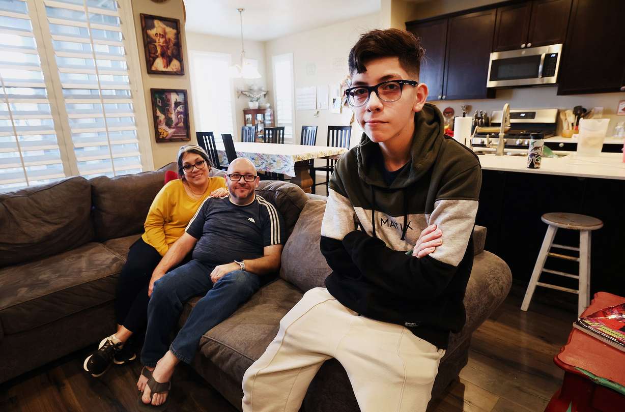 Veronica and Michael Bernard and their 15-year-old son Jacob pose for photos in their West Jordan home on Monday.