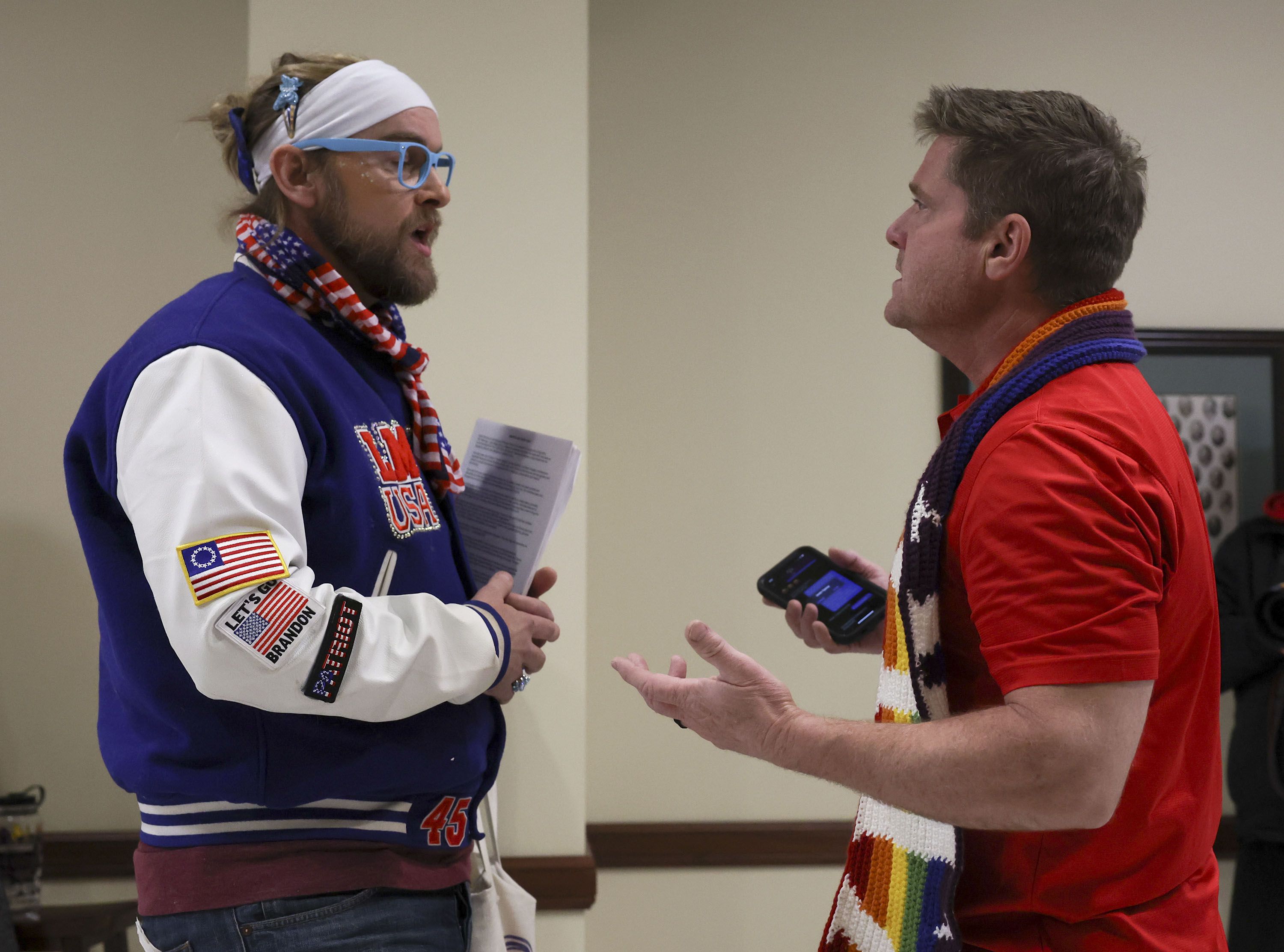 Ryan Woods and Nate Brimhall debate transgender issues after a Senate Health and Human Services Standing Committee meeting at the Capitol in Salt Lake City on Wednesday. Woods is a gay drag artist who goes by “Lady Maga USA” and Brimhall is a father of a transgender child.