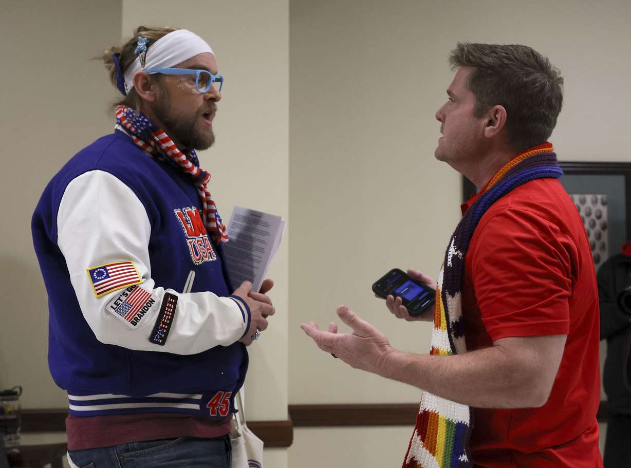 Ryan Woods and Nate Brimhall debate transgender issues after a Senate Health and Human Services Standing Committee meeting at the Capitol in Salt Lake City on Wednesday. Woods is a gay drag artist who goes by “Lady Maga USA” and Brimhall is a father of a transgender child.