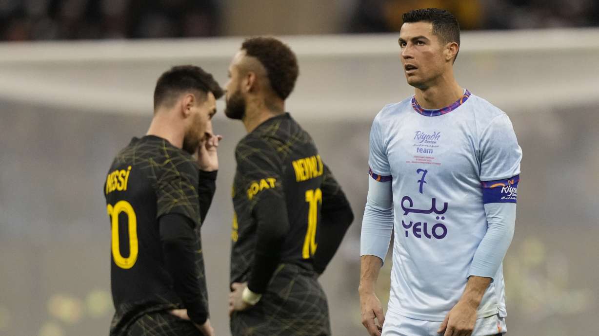 Cristiano Ronaldo playing for a combined XI of Saudi Arabian teams Al Nassr and Al Hilal is flanked by PSG's Lionel Messi and his teammate Neymar during a friendly soccer match, at the King Saud University Stadium, in Riyadh, Saudi Arabia, Thursday, Jan. 19, 2023.