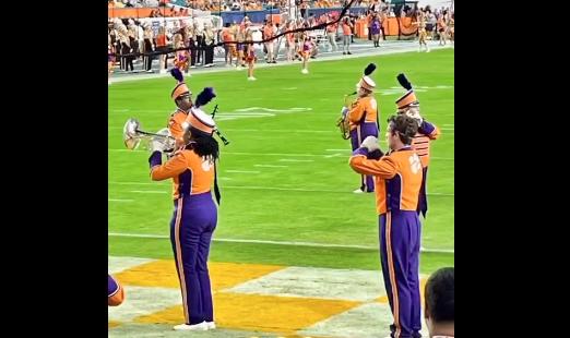 A member of the marching band is without an instrument, for whatever reason, at the Orange Bowl, Dec. 30 in Florida.