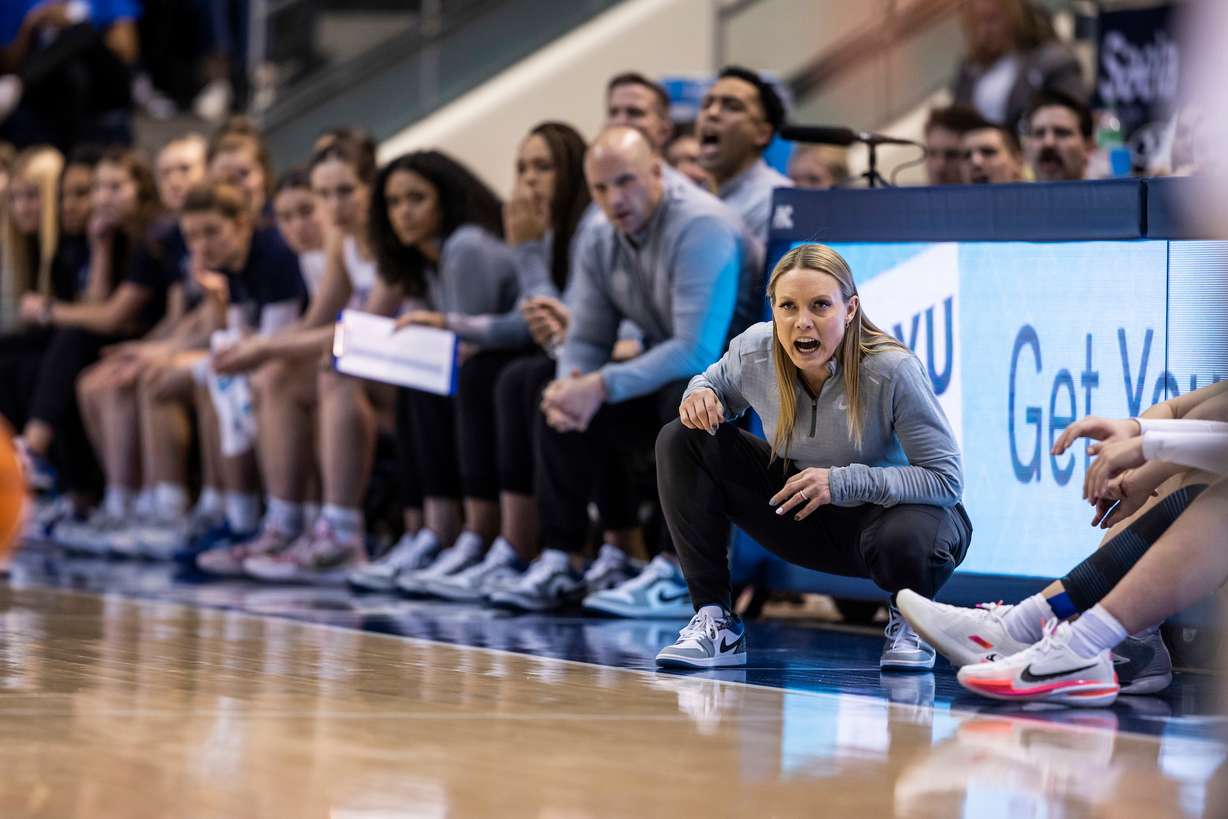 BYU coach Amber Whiting, shown here with her assistants during the Cougars' 63-49 win over San Diego, Jan. 7, 2023, has her team riding a seven-game winning streak and is up to third in the West Coast Conference standings after a 78-58 win over San Francisco, Thursday, Jan. 19, 2023 in the Marriott Center.