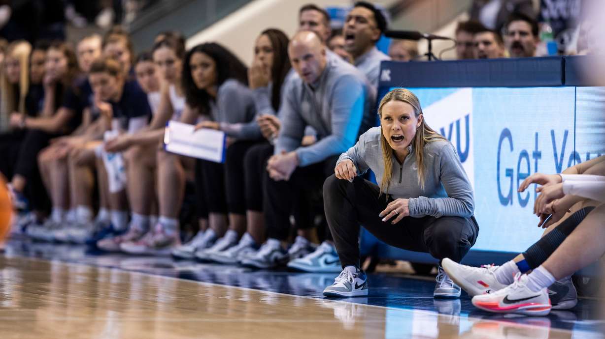 BYU coach Amber Whiting with her assistants during the Cougars' 63-49 win over San Diego, Jan. 7, 2023. BYU won its seventh-straight game Thursday, knocking off San Francisco, 78-59, improving Whiting's record to 13-7 as a collegiate head coach.