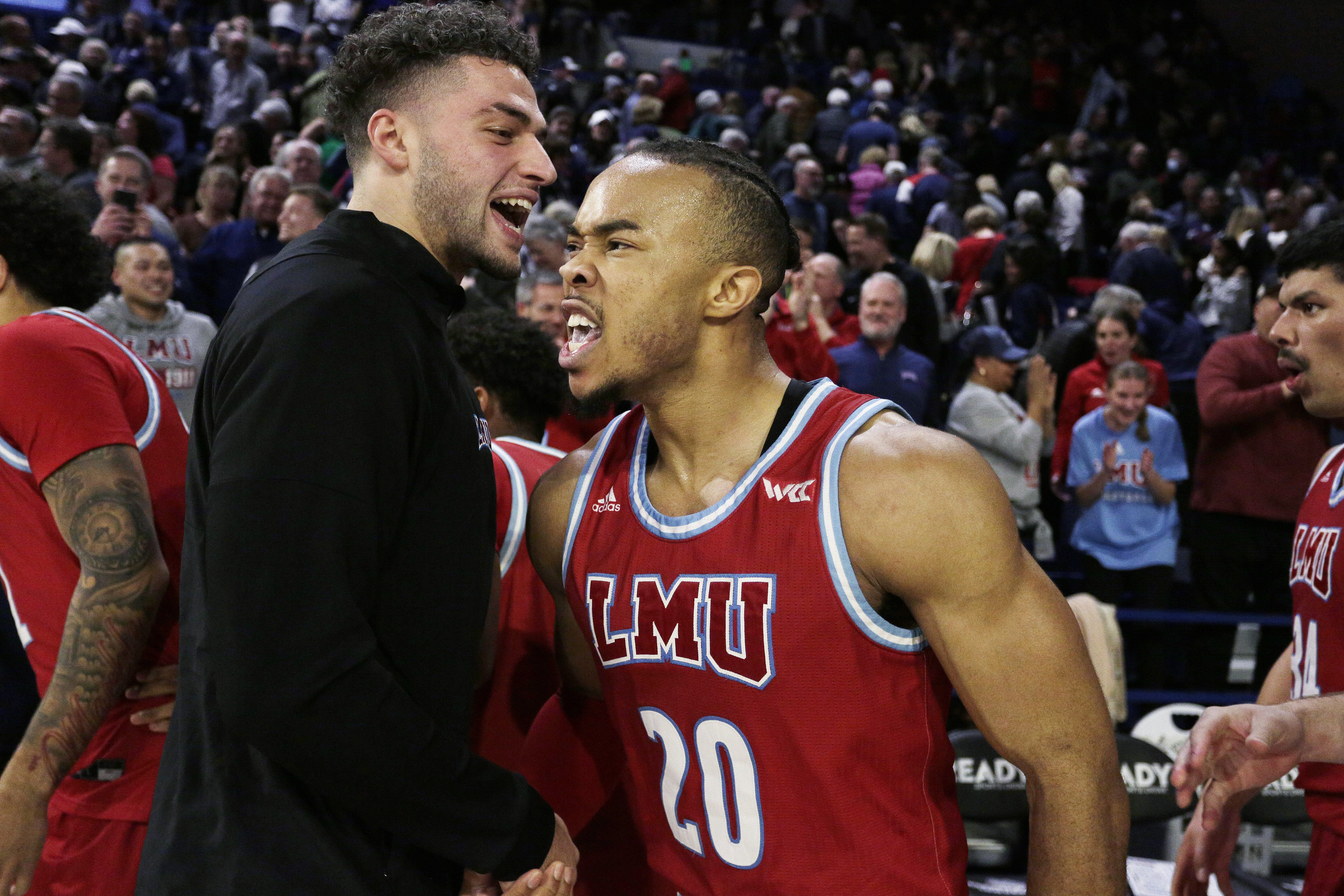 Loyola Marymount guard Cam Shelton (20) celebrates the team's 68-67 win against Gonzaga after an NCAA college basketball game, Thursday, Jan. 19, 2023, in Spokane, Wash. 