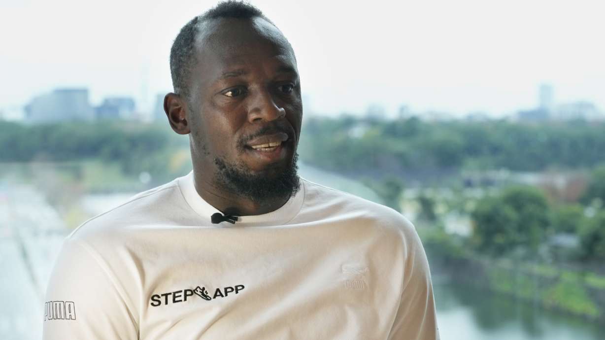 FILE - Usain Bolt, a retired Jamaican sprinter, speaks during an interview in Tokyo, Dec. 1, 2022. Attorneys for Bolt, one of the world’s greatest sprinters, said more than $12.7 million is missing from his account with a private investment firm in Jamaica that authorities are investigating. Attorney Linton P. Gordon on Jan. 18, 2023 provided the A.P. with a copy of a letter sent to Stocks & Securities Limited demanding that the money be returned or further action will be taken.