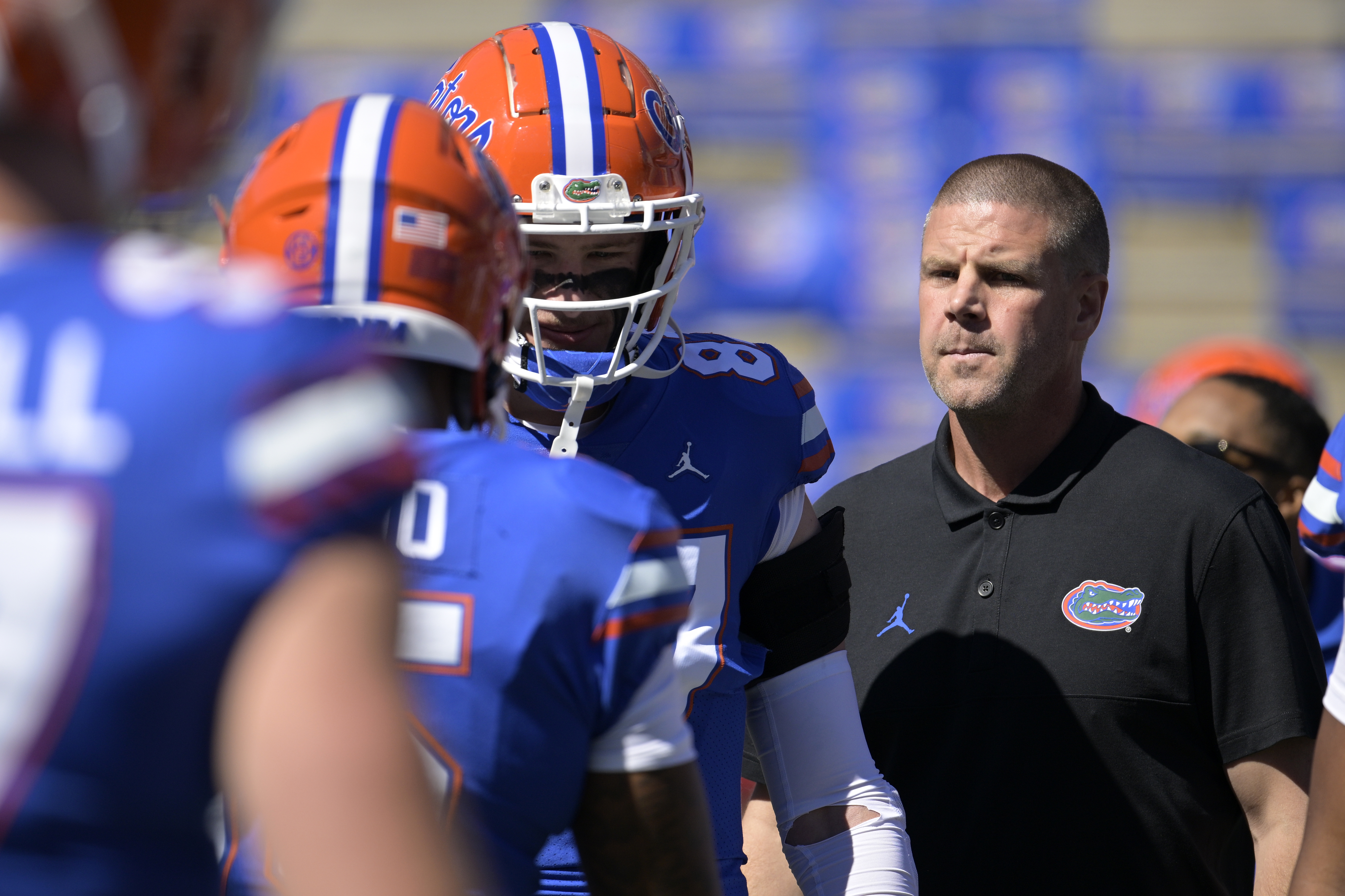 FILE - Florida head coach Billy Napier, right, watches players warm up before an NCAA college football game against Eastern Washington, Sunday, Oct. 2, 2022, in Gainesville, Fla. A person familiar with the situation says Florida quarterback recruit Jaden Rashada requested a release from his national letter of intent Tuesday, Jan. 17, 2023 after a $13 million name, imagine and likeness deal fell through.