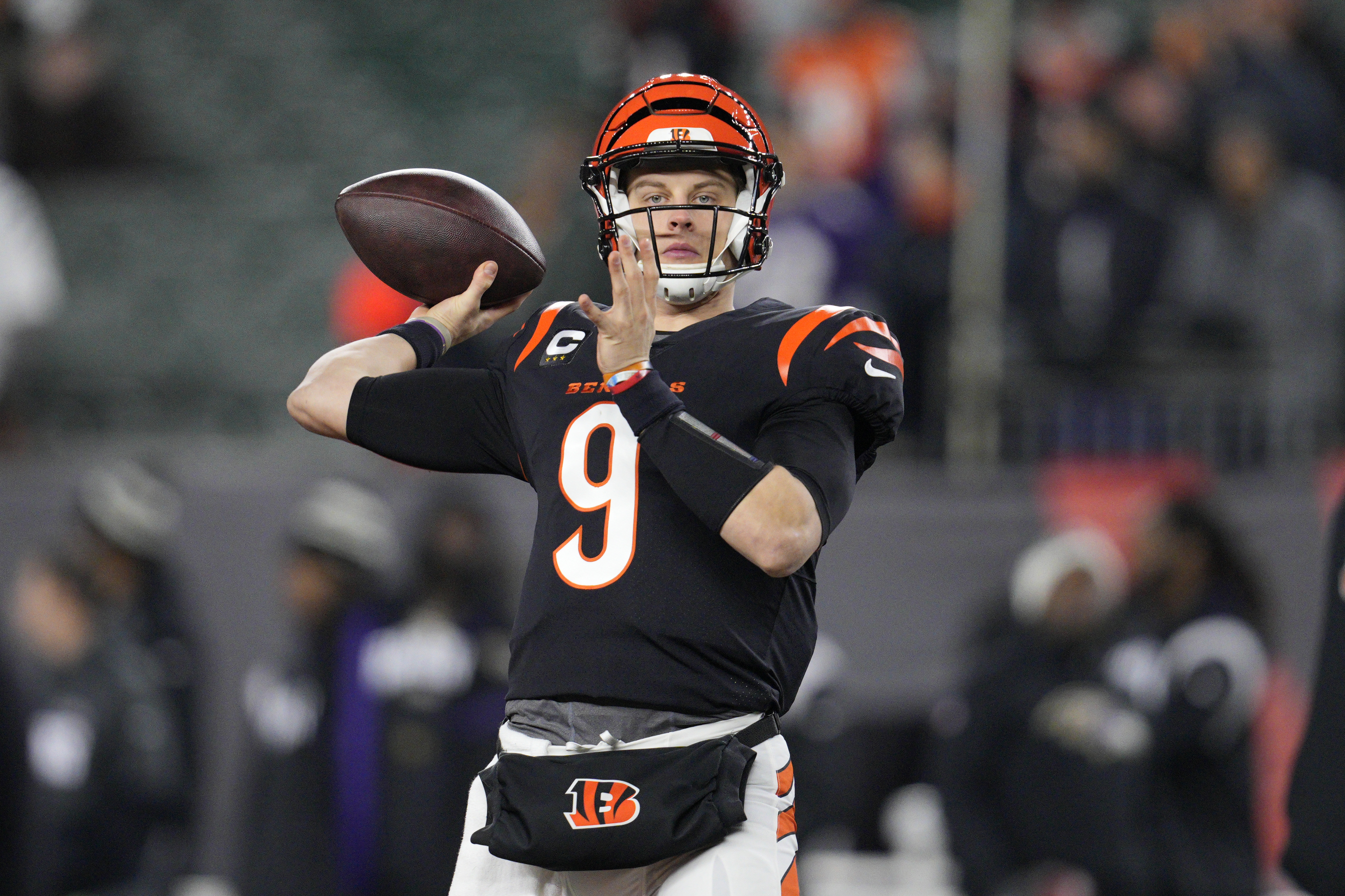 Cincinnati Bengals quarterback Joe Burrow (9) warms up before an NFL wild-card playoff football game against the Baltimore Ravens in Cincinnati, Sunday, Jan. 15, 2023. 
