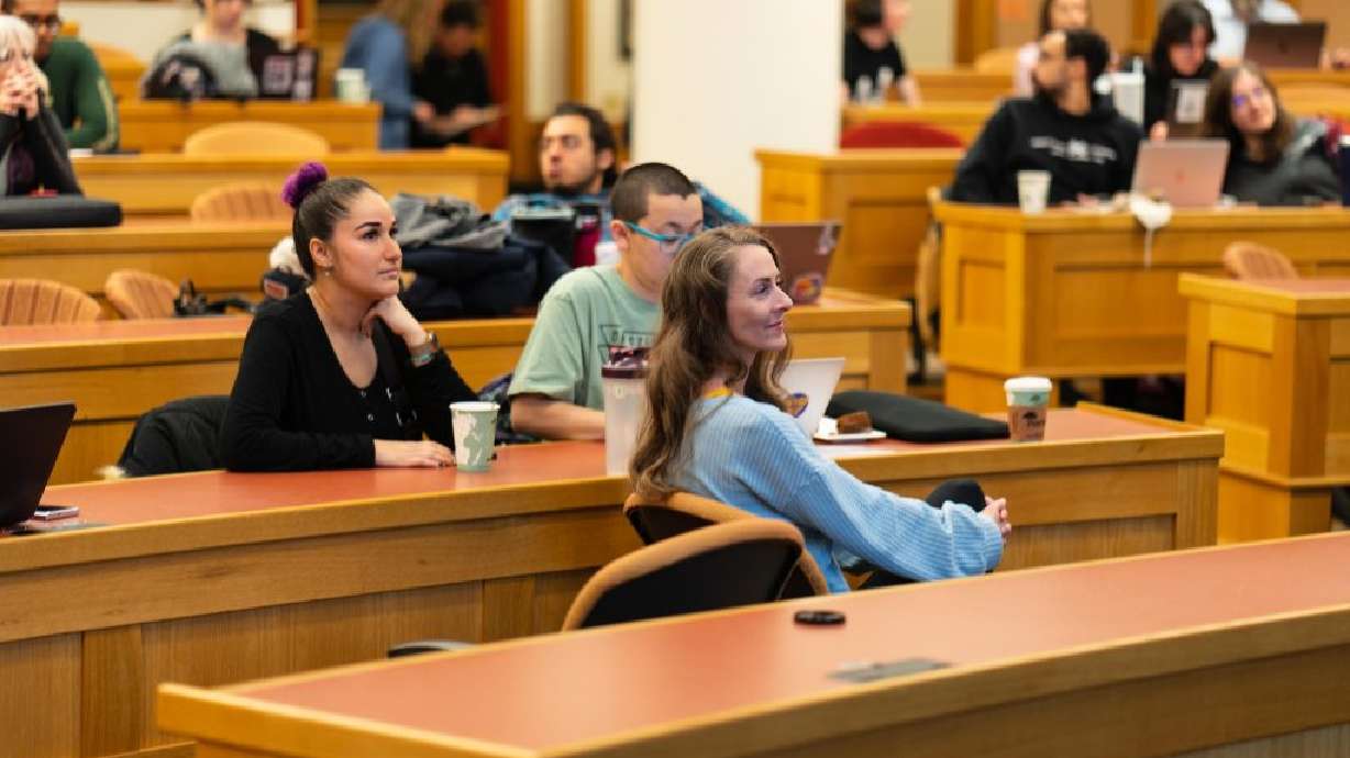Audience listens in to jurors from an October trial in St. George that exonerated two animal activists at the University of Denver’s Sturm College of Law, Denver, Colo., Jan. 13, 2022.