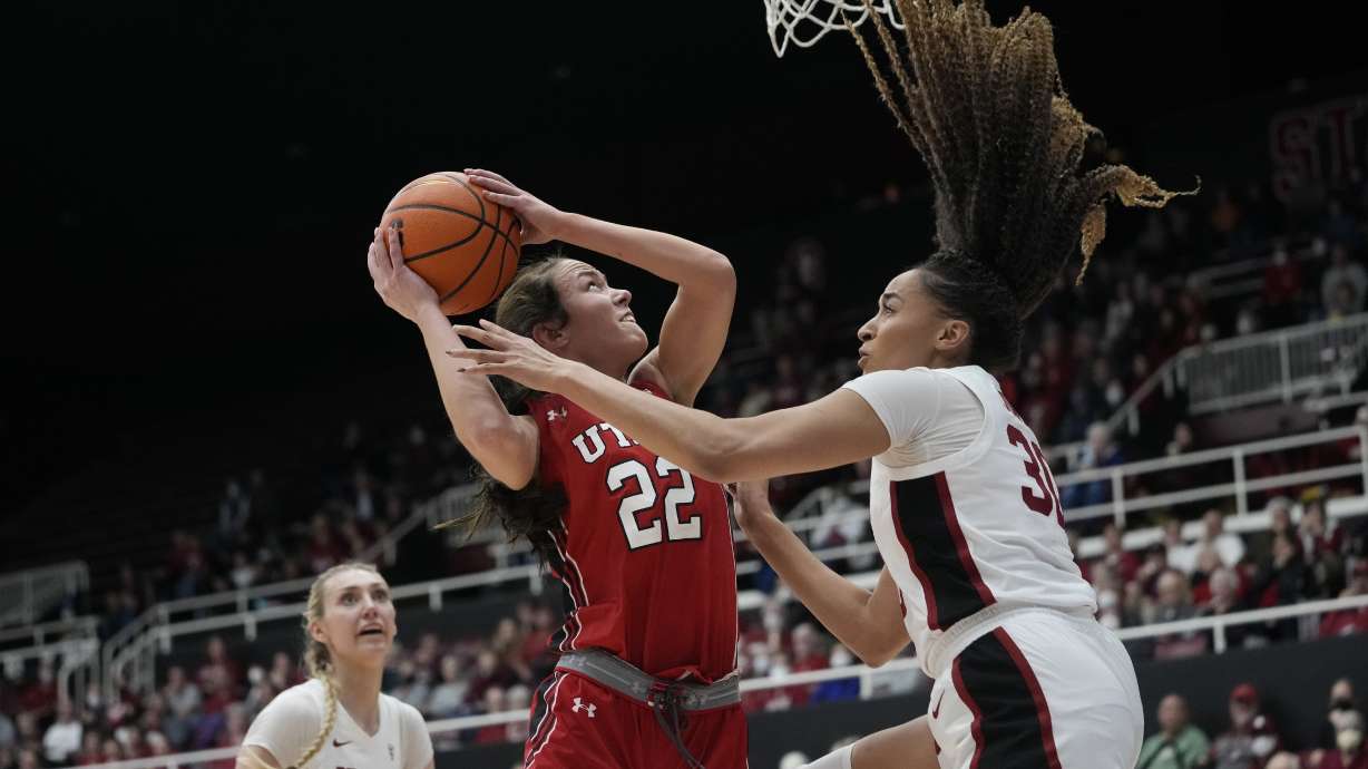 Utah forward Jenna Johnson (22) shoots over Stanford guard Haley Jones, right, during the first half of an NCAA college basketball game in Stanford, Calif., Friday, Jan. 20, 2023.