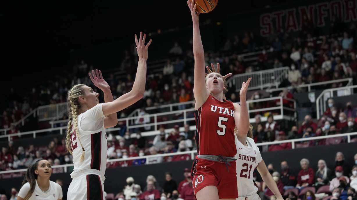 Utah guard Gianna Kneepkens (5) shoots next to Stanford forward Cameron Brink, left, during the first half of an NCAA college basketball game in Stanford, Calif., Friday, Jan. 20, 2023.