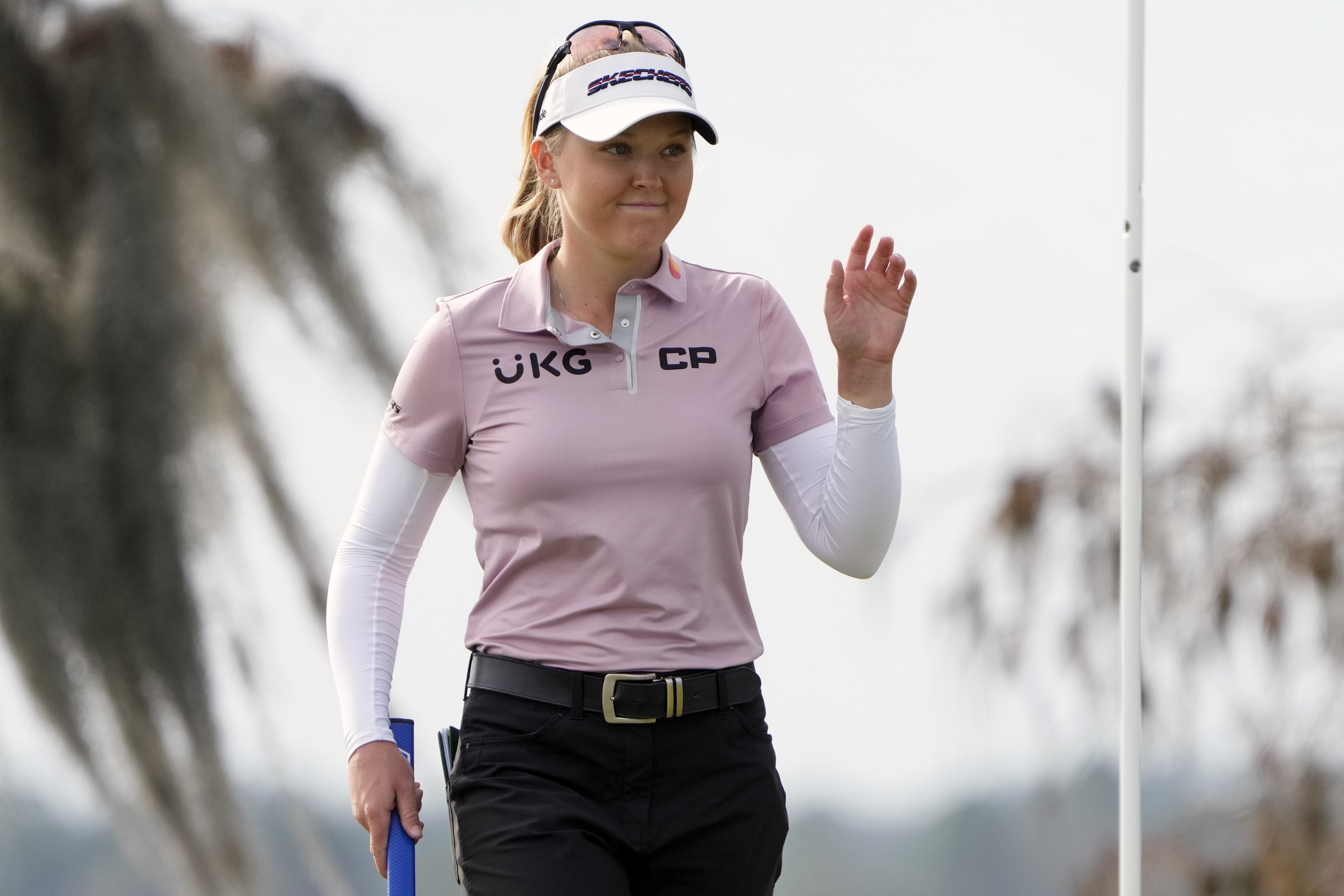 Brook Henderson waves to the gallery after sinking a birdie putt on the 18th green during the first round of the LPGA Hilton Grand Vacations Tournament of Champions Thursday, Jan. 19, 2023, in Orlando, Fla. 
