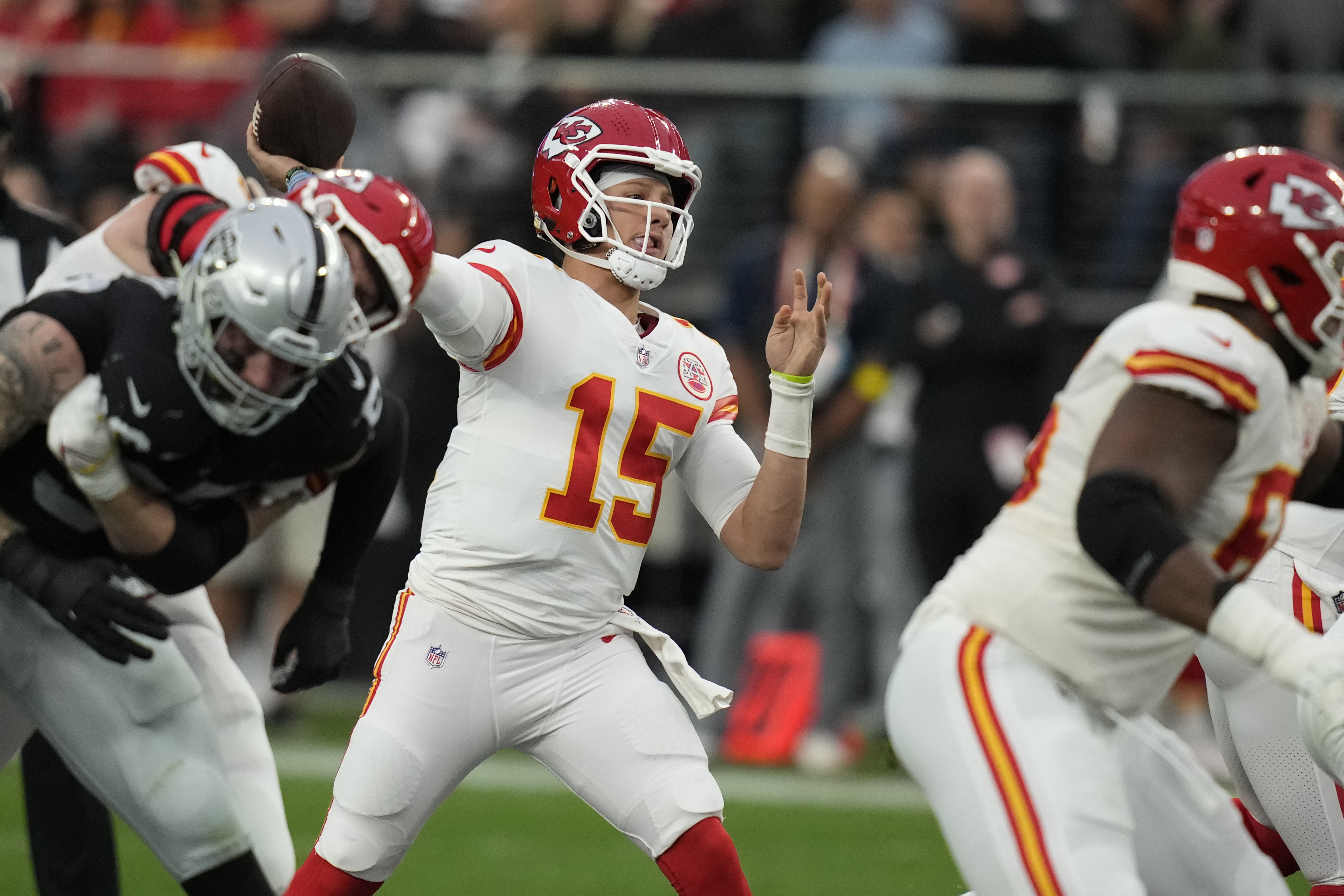 Kansas City Chiefs quarterback Patrick Mahomes throws during the first half of an NFL football game against the Las Vegas Raiders Saturday, Jan. 7, 2023, in Las Vegas.
