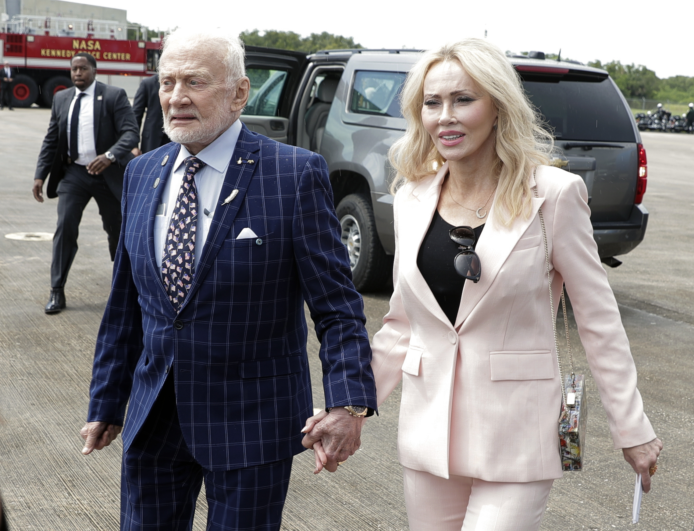 Apollo 11 astronaut Buzz Aldrin, left, and Anca Faur arrive at the Kennedy Space Center for a visit in recognition of the Apollo 11 moon landing anniversary, on July 20, 2019, in Cape Canaveral, Fla. Astronaut Edwin “Buzz” Aldrin announced on Facebook that he has married Anca Faur, his “longtime love” in a small ceremony in Los Angeles on Friday, which was his 93rd birthday.