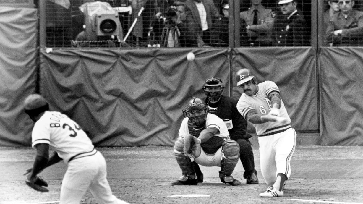 FILE - Oakland Athletics Sal Bando slams a double to center field in the sixth inning to score teammate Allan Lewis and the winning run in the final game of World Series against Cincinnati Reds in Cincinnati, Ohio, on, Oct. 22, 1972. Bando, a three-time World Series champion with the Oakland Athletics and former Milwaukee Brewers executive, died Friday night, Jan. 20, 2023, in Oconomowoc, Wis., according to a statement from his family. He was 78.