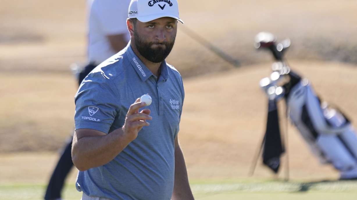 Jon Rahm acknowledges the gallery as he walks off the third green during the American Express golf tournament on the Pete Dye Stadium Course at PGA West Saturday, Jan. 21, 2023, in La Quinta, Calif.