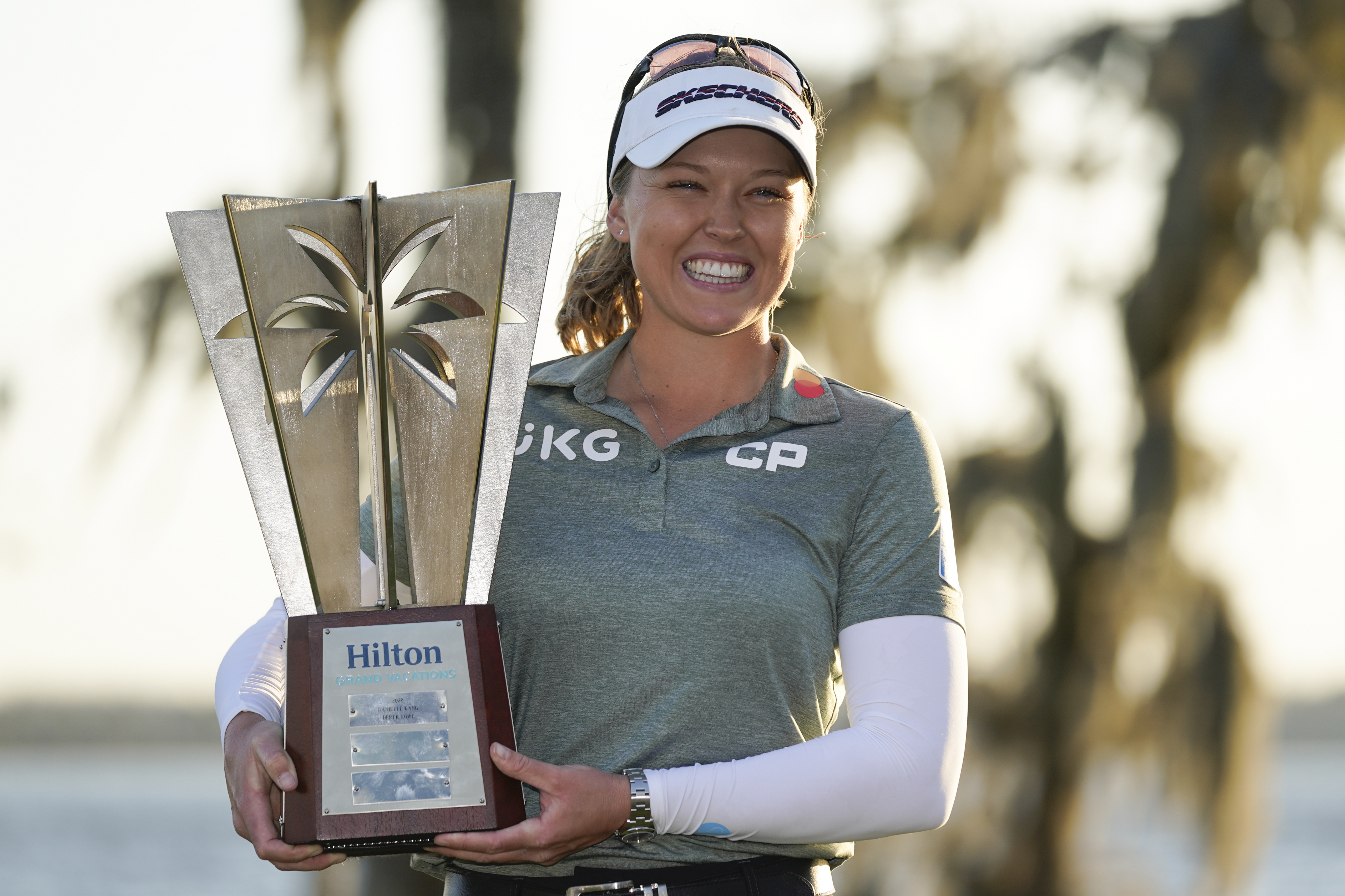 Brooke Henderson holds up the championship trophy after winning the LPGA Hilton Grand Vacations Tournament of Champions, Sunday, Jan. 22, 2023, in Orlando, Fla. 