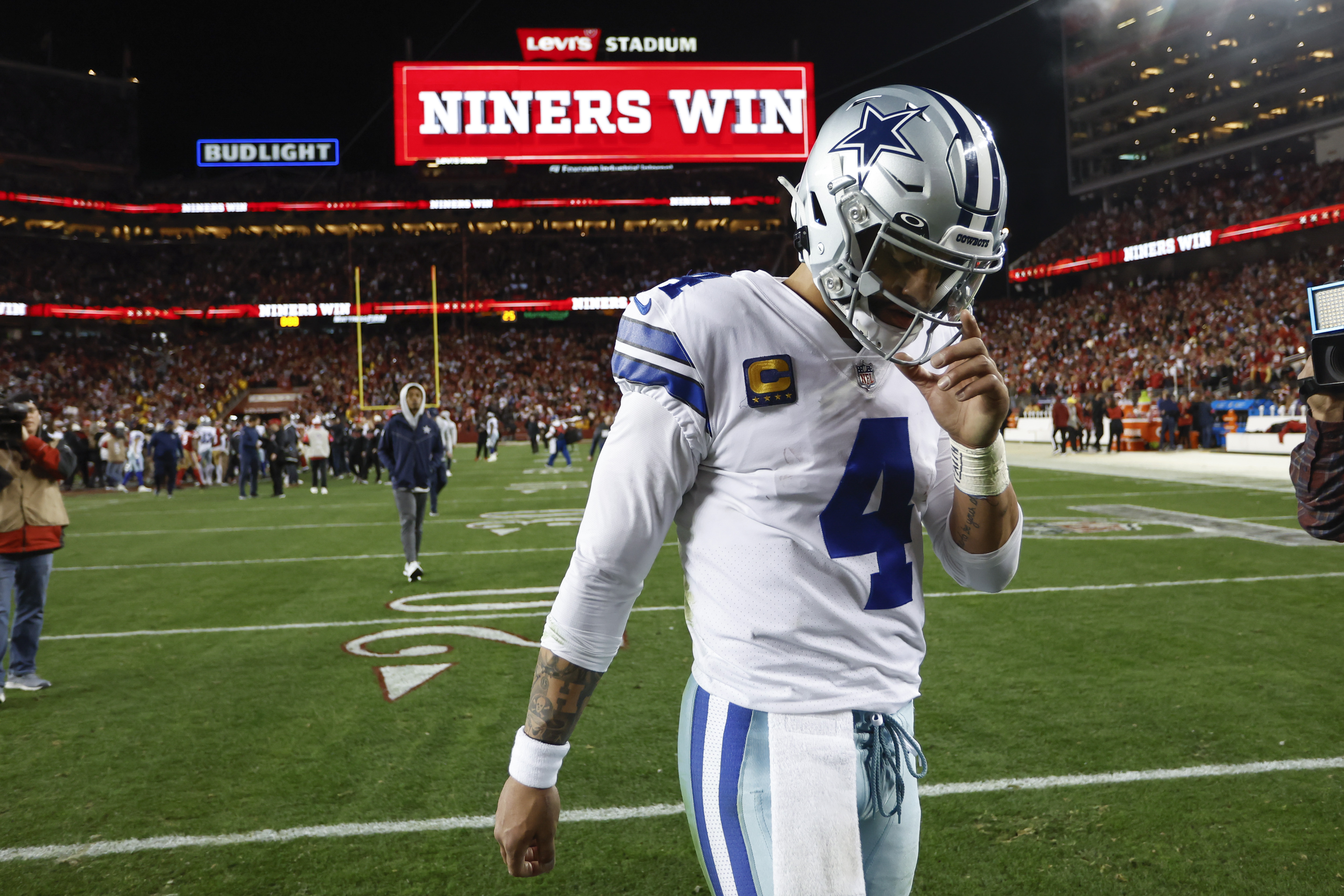 Dallas Cowboys quarterback Dak Prescott (4) walks off the field after an NFL divisional round playoff football game against the San Francisco 49ers in Santa Clara, Calif., Sunday, Jan. 22, 2023. 