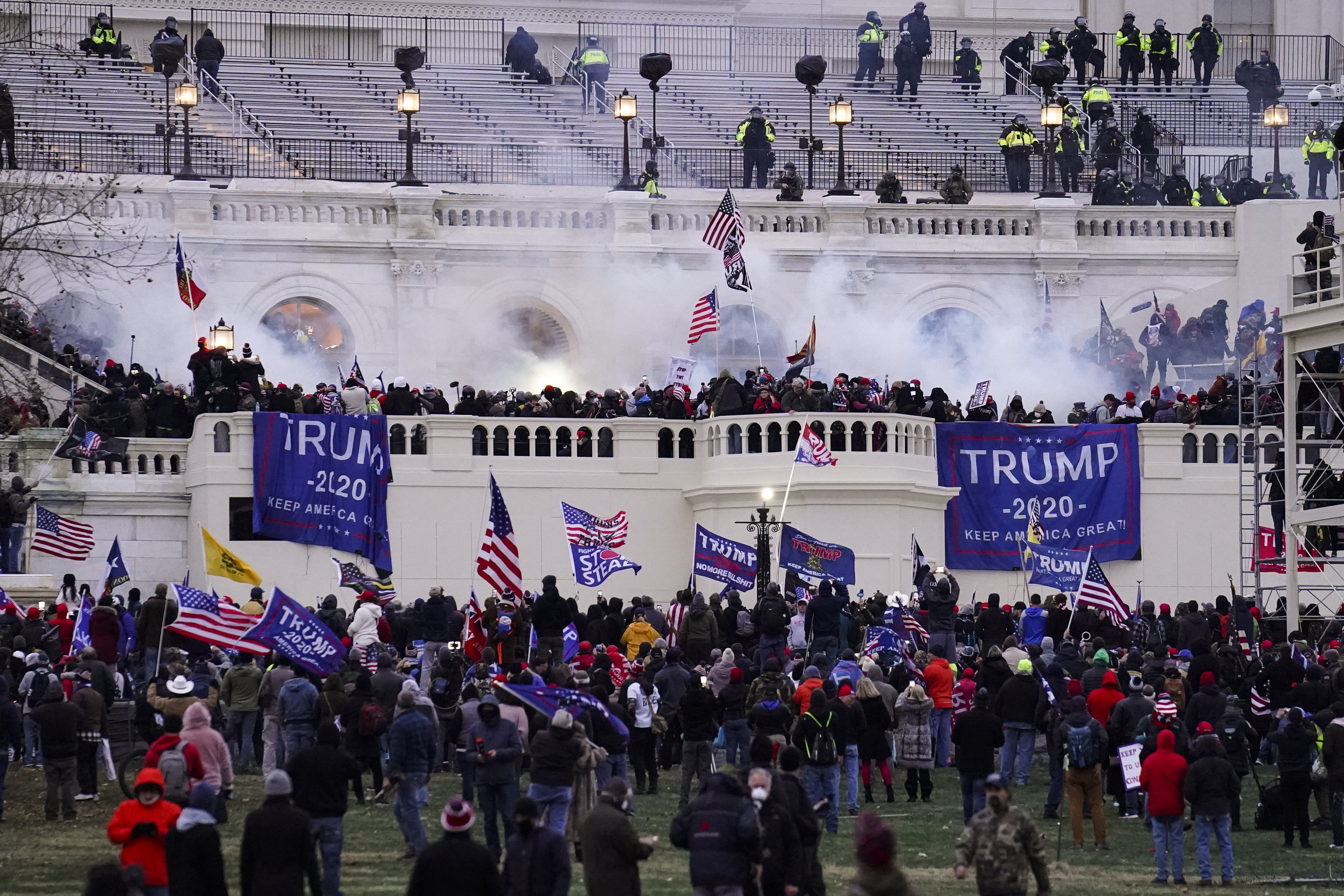 Violent insurrectionists loyal to President Donald Trump, storm the Capitol, Jan. 6, 2021, in Washington. An Arkansas man who propped his feet up on a desk in then-House Speaker Nancy Pelosi's office during the riot was convicted Monday.