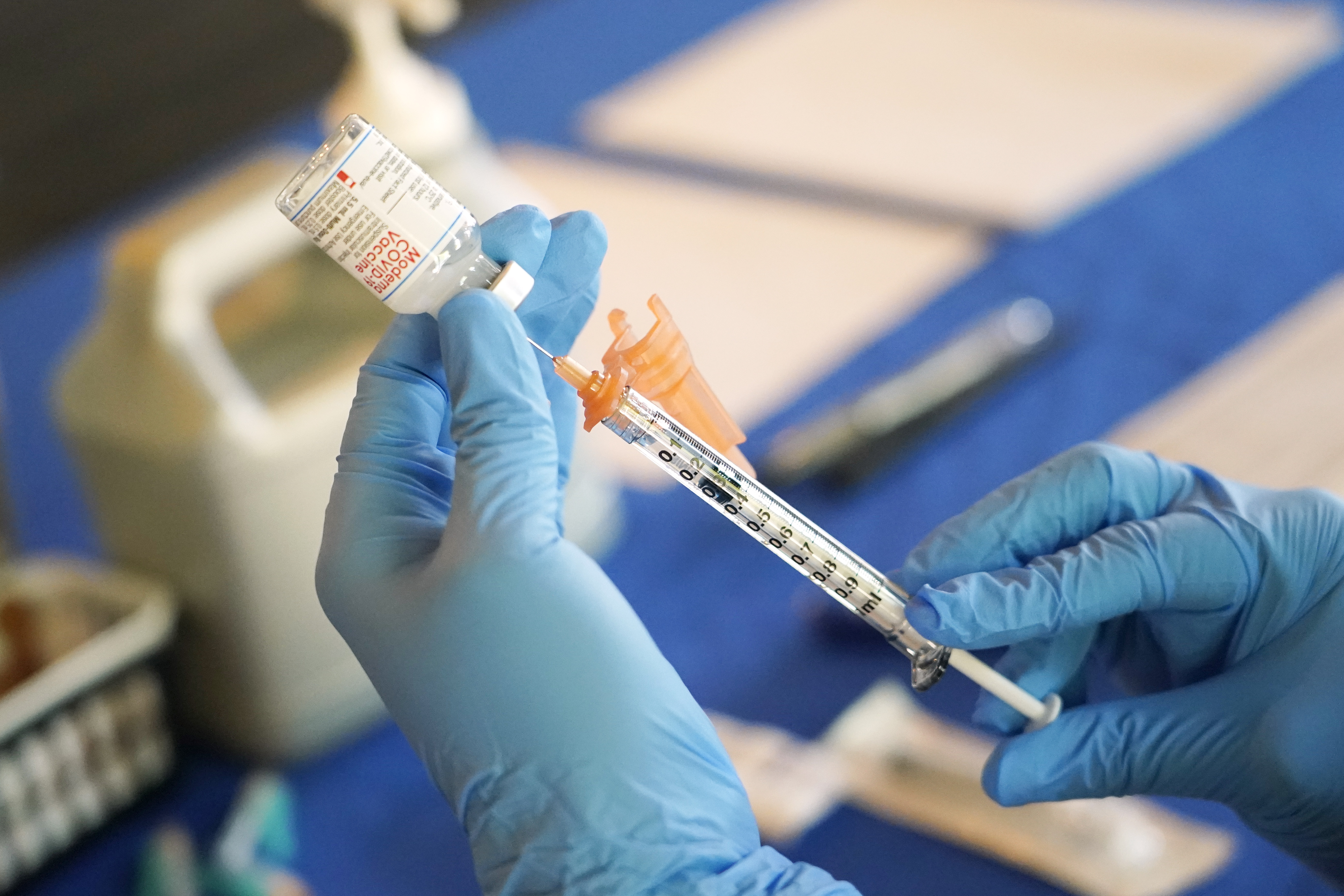 A nurse prepares a syringe of a COVID-19 vaccine in Jackson, Miss., July 19, 2022. U.S. health officials are proposing a simplified approach to COVID-19 vaccinations, which would allow most people to get a once-a-year shot.