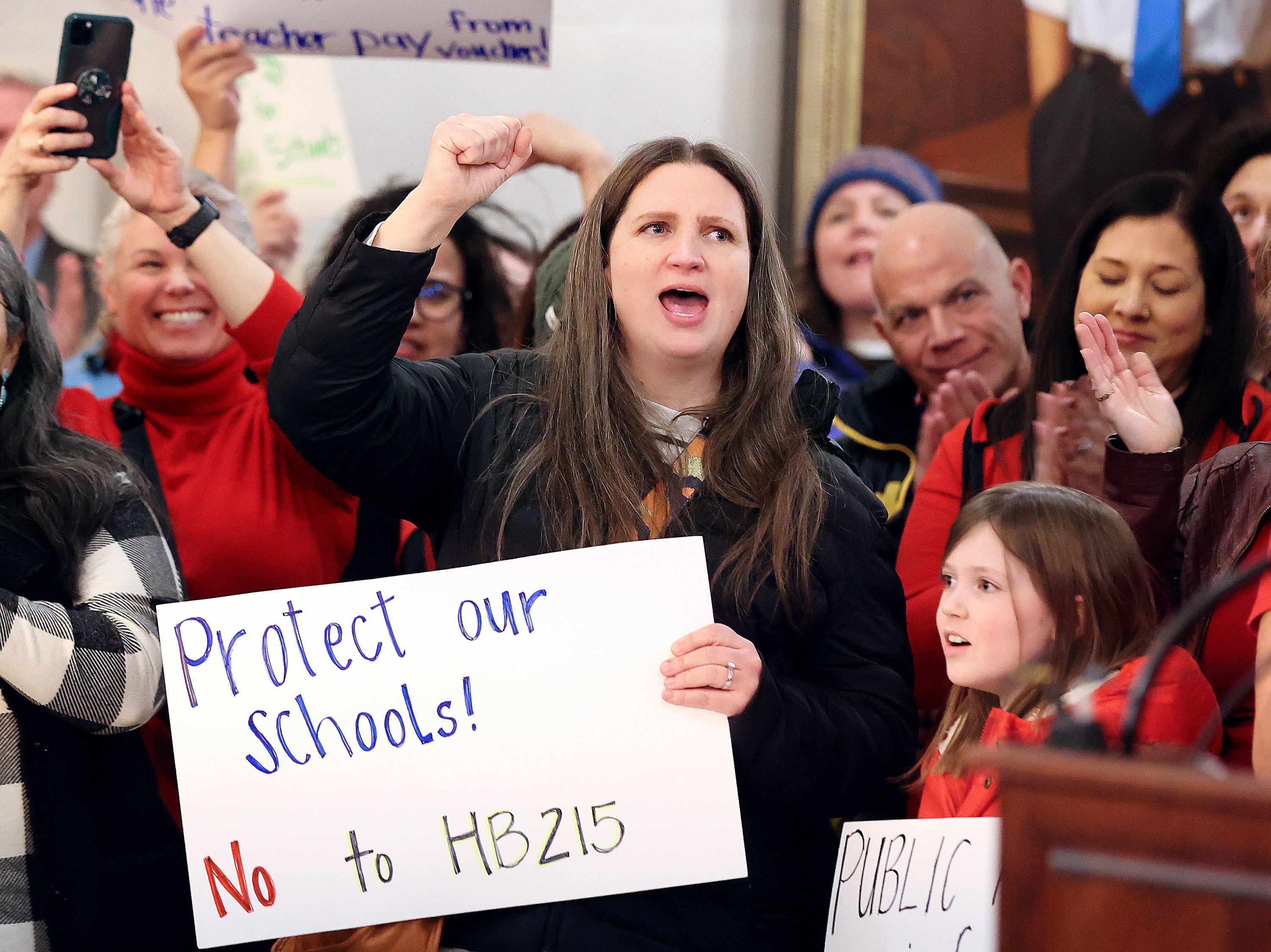 Barbara Thornton and her daughter Bonnie Thornton cheer at a rally against school vouchers at the Capitol in Salt Lake City, on Monday, Jan. 23, 2023. Barbara also has another child with special needs and is a substitute teacher.