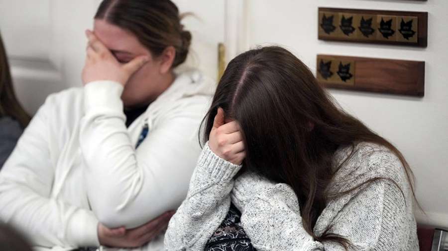 Two women hold back tears at a news conference at city hall on the murder of eight people in the same family on Jan. 5 in Enoch, Iron County. Michael Haight, who was 42, is believed to have killed his wife, mother-in-law and his five kids ranging in ages from 17 to 4 years old with a gun in his home.
