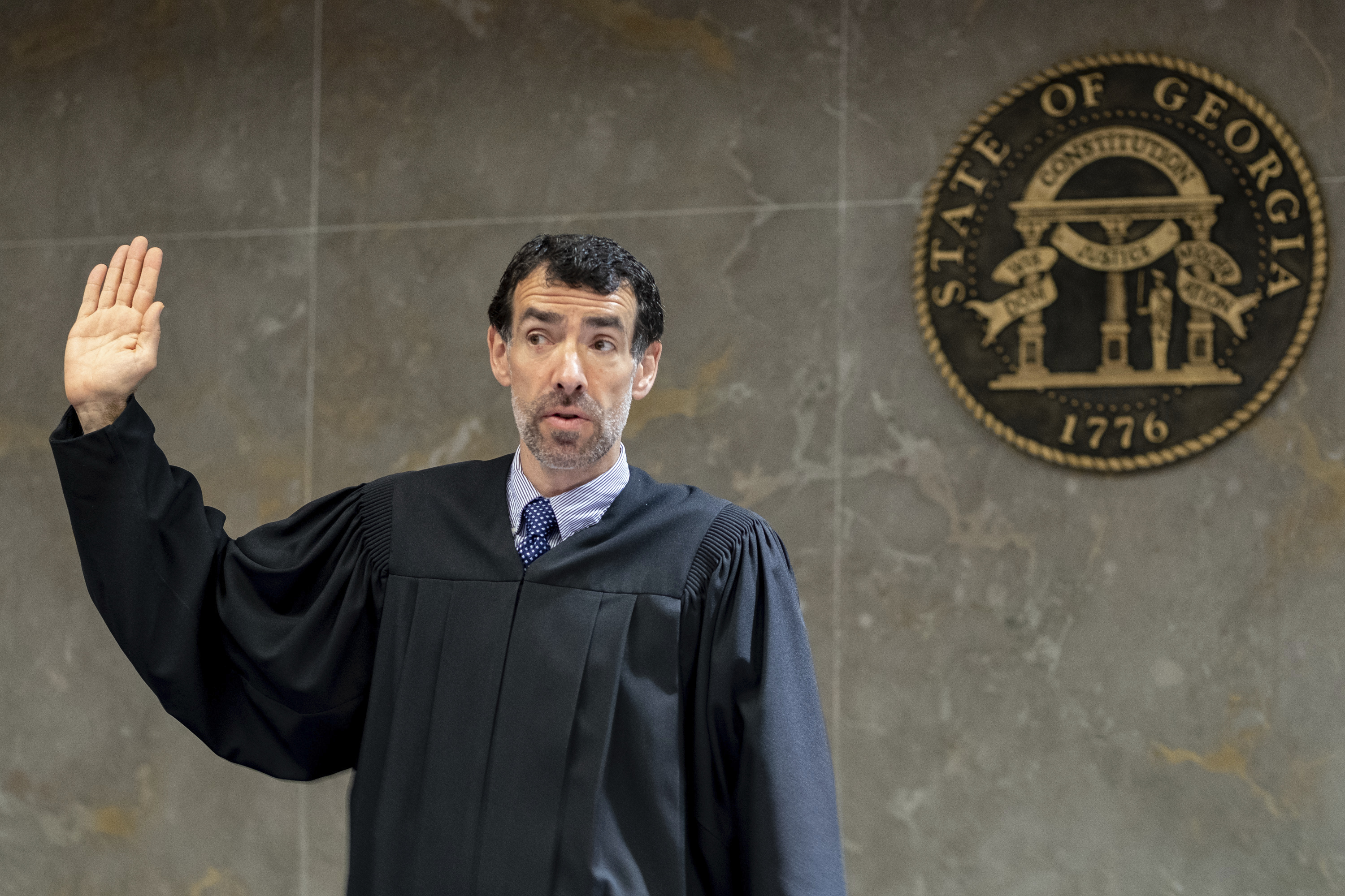 Fulton County Superior Court Judge Robert McBurney swears in potential jurors during proceedings to seat a special purpose grand jury in Atlanta, on May 2, 2022. Portions of a Georgia special grand jury's report on Donald Trump's efforts to overturn the state's 2020 election should be publicly released, McBurney said Monday.