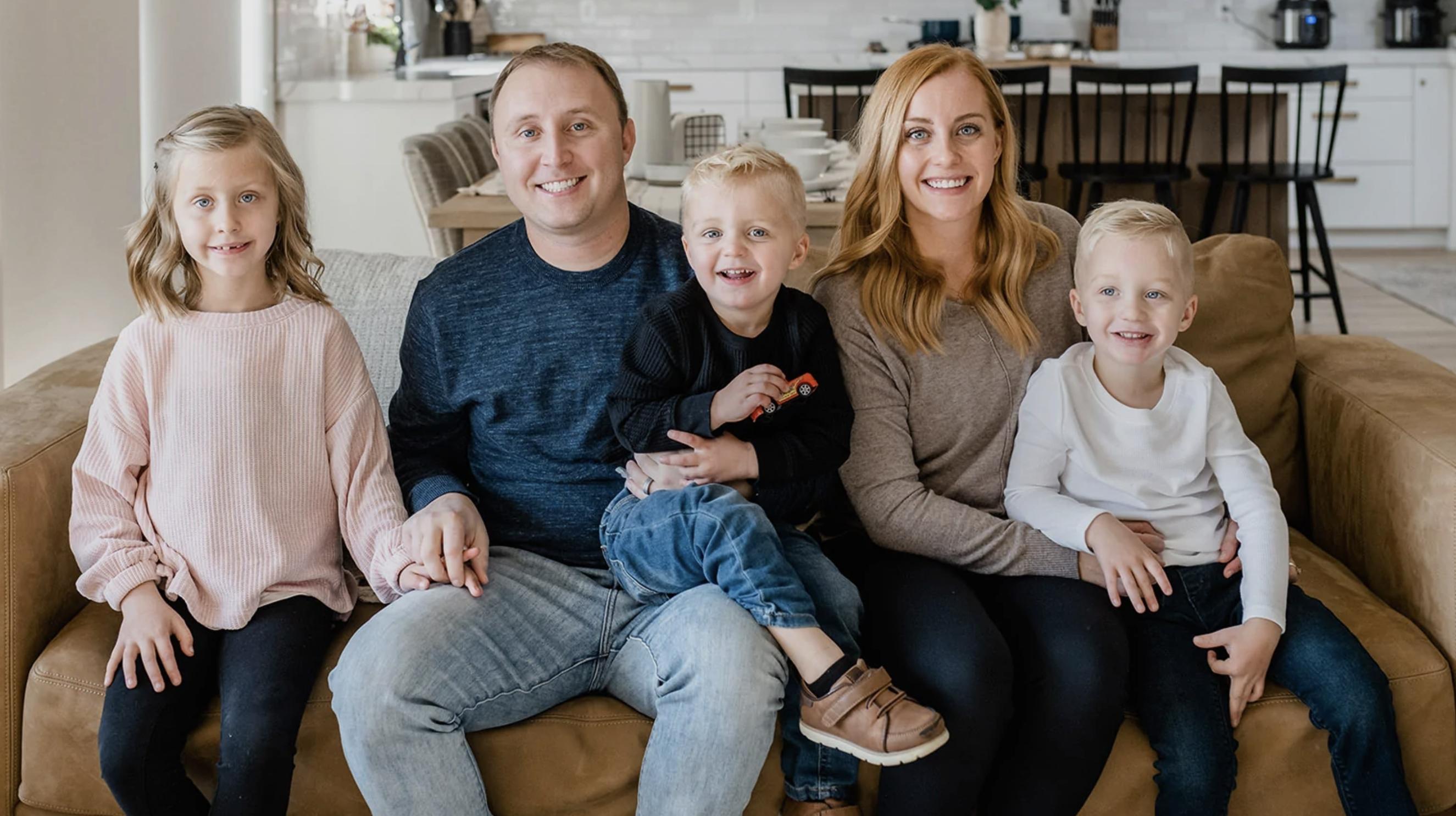 Allyse and Adam Jackson at home with their family.