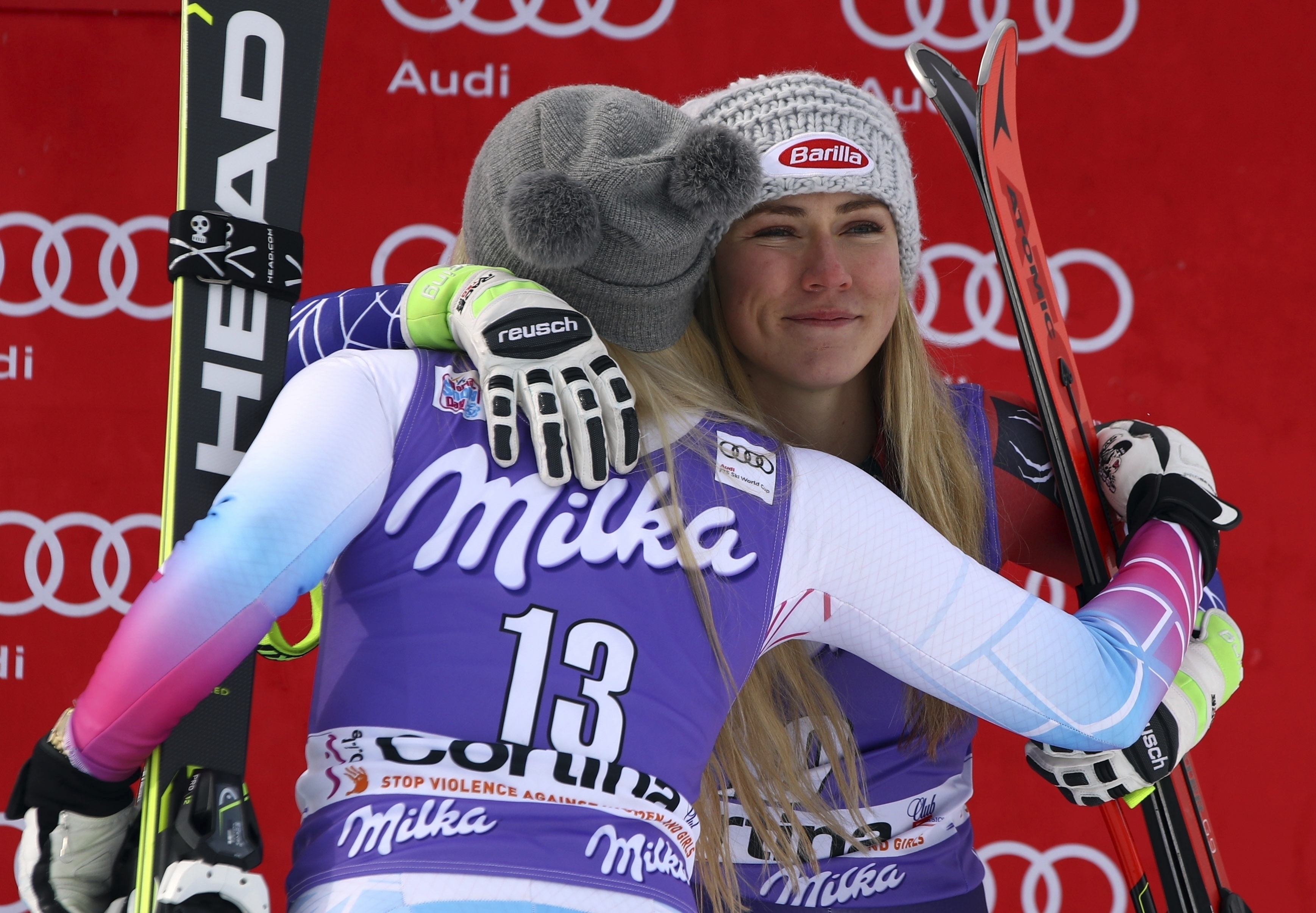 FILE - United States' Mikaela Shiffrin, third place in an alpine ski, women's World Cup downhill, right, is hugged by second-placed United States' Lindsey Vonn, in Cortina D'Ampezzo, Italy, In this Friday, Jan. 19, 2018 file photo. Mikaela Shiffrin has had a World Cup skiing career like no other woman. Shiffrin raced to a record-breaking 83rd win Tuesday, Jan. 24, 2023. 