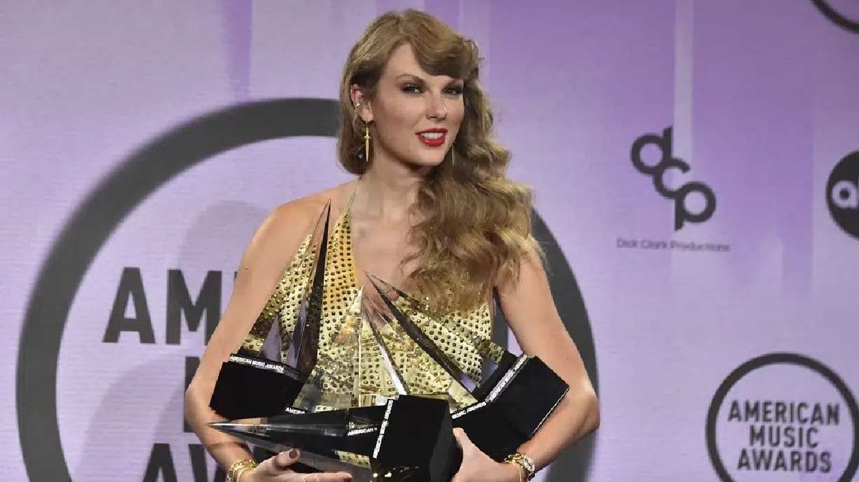 Taylor Swift poses in the press room with awards at the American Music Awards on Nov. 20, 2022, in Los Angeles. Senators are grilling Ticketmaster Tuesday about its spectacular breakdown last year during a sale of Taylor Swift concert tickets