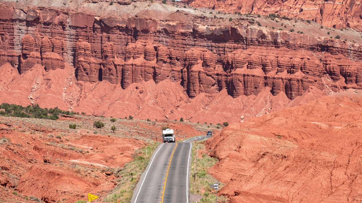 An RV travels through Capitol Reef National Park on May 22, 2021. Visitation at Utah's national parks dropped by almost 7% from 2021 to 2022, according to national parks data.