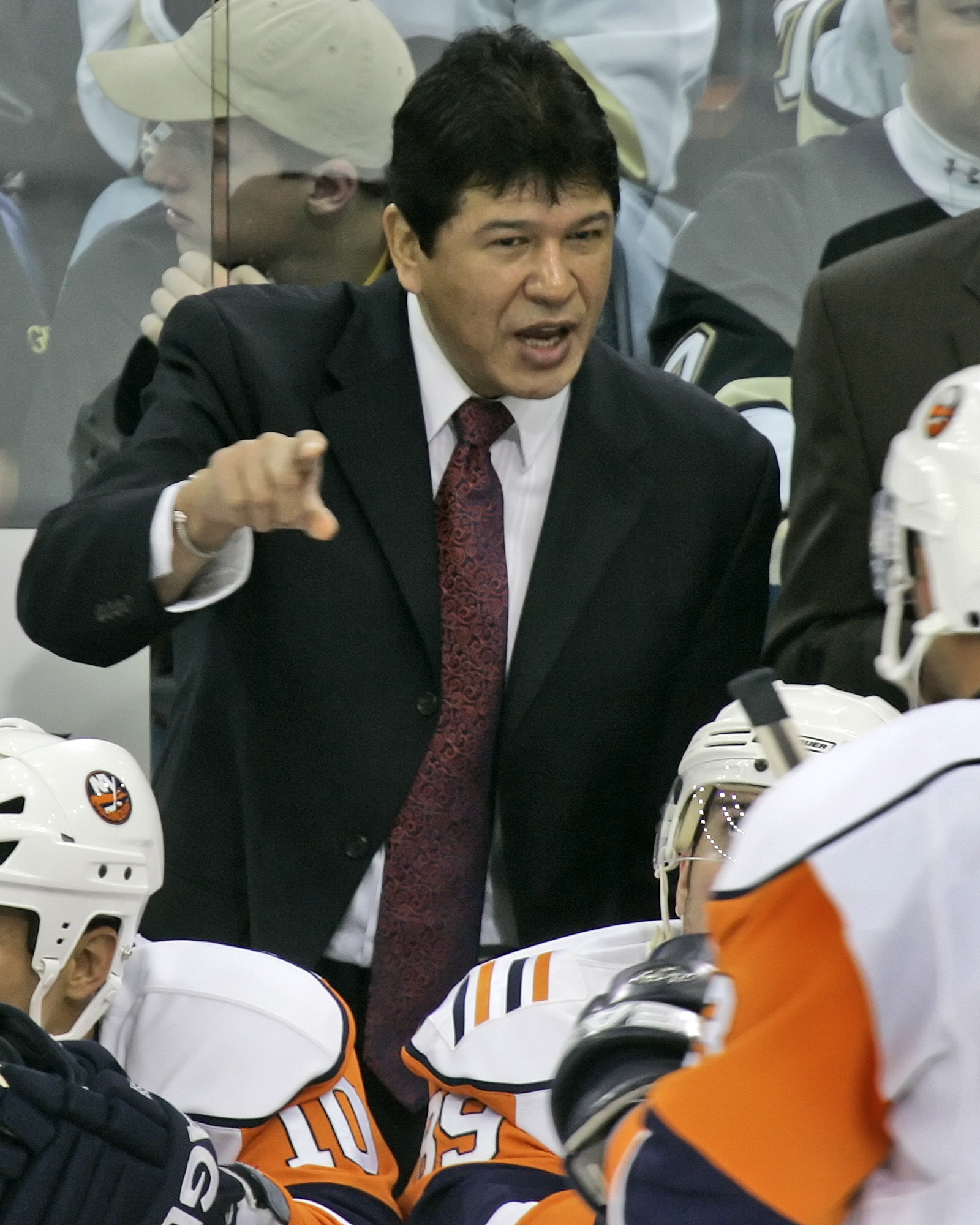 FILE - New York Islanders coach Ted Nolan talks with his players during a timeout late in the third period of an NHL hockey game against the Pittsburgh Penguins in Pittsburgh, Thursday, Nov. 15, 2007. Nolan finally has his rookie card more than 40 years since making his NHL debut. Better late than never, particularly because it includes a nod to his First Nations heritage. 