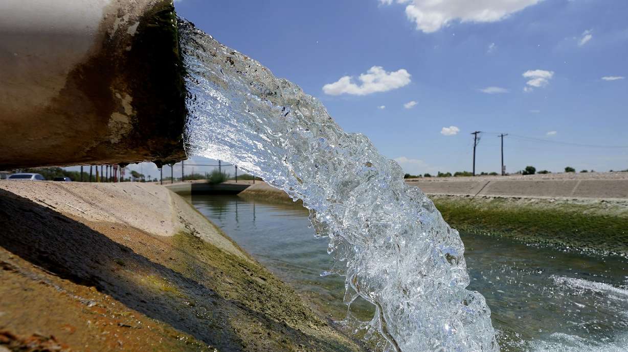 Water from the Colorado River diverted through the Central Arizona Project fills an irrigation canal on Aug. 18, 2022, in Maricopa, Ariz. A Maricopa County judge in Arizona denied residents emergency relief over their Scottsdale, Ariz., water source that has been cut off since Jan. 1 because of drought conditions.