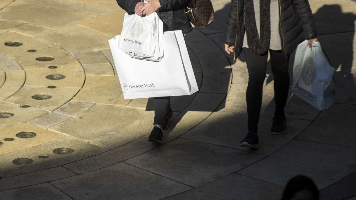 Mallgoers walk around City Creek Center in Salt Lake City on Dec. 17, 2022. A run of robust U.S. consumer spending appears to be finally waning, according to data reports.