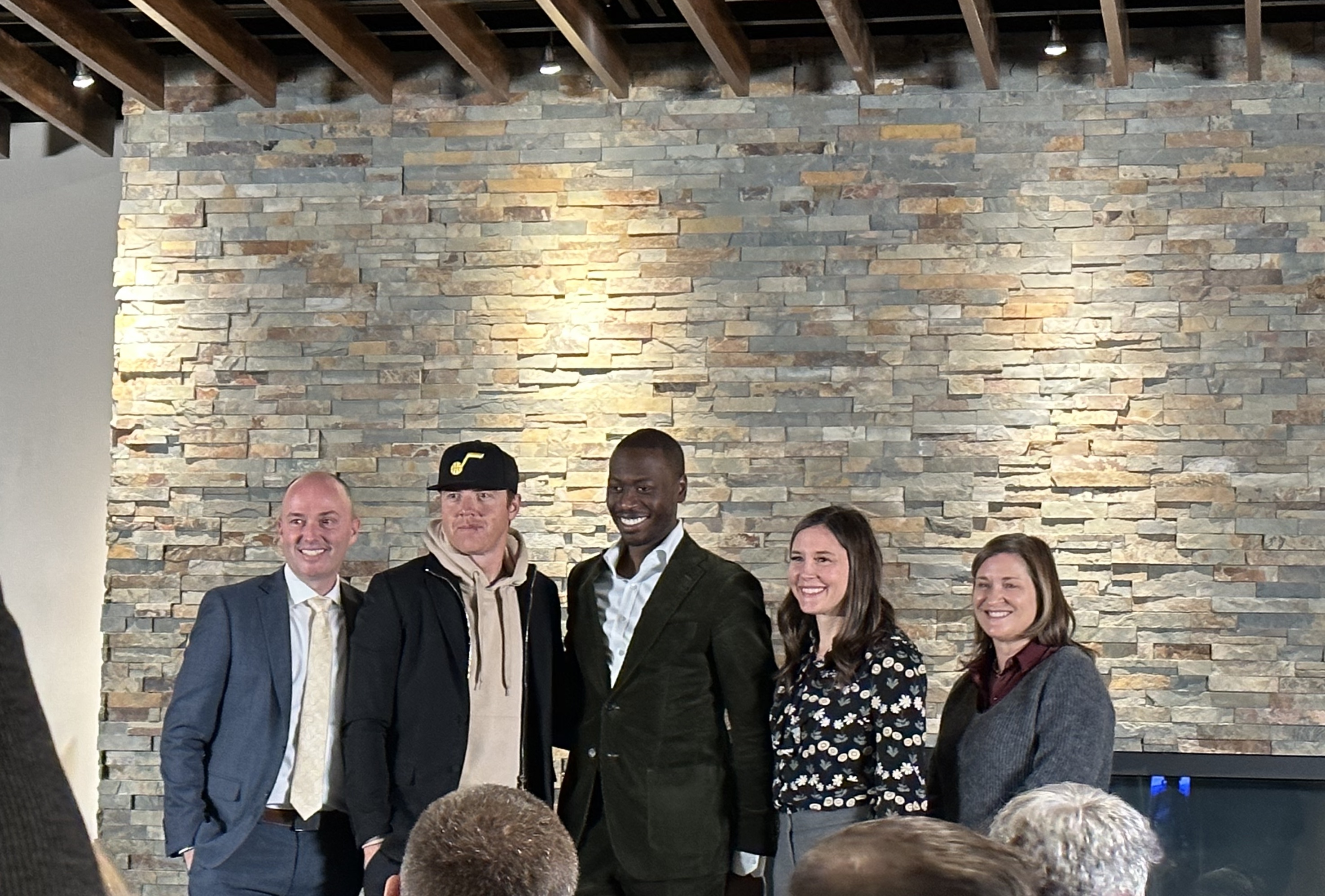Gov. Spencer Cox, Utah Jazz owner Ryan Smith, National Basketball Social Justice Coalition Executive Director James Cadogan, Salt Lake City Mayor Erin Mendenhall and Salt Lake County Mayor Jenny Wilson pose for a picture after speaking at an expungement clinic at Vivint Arena Tuesday.