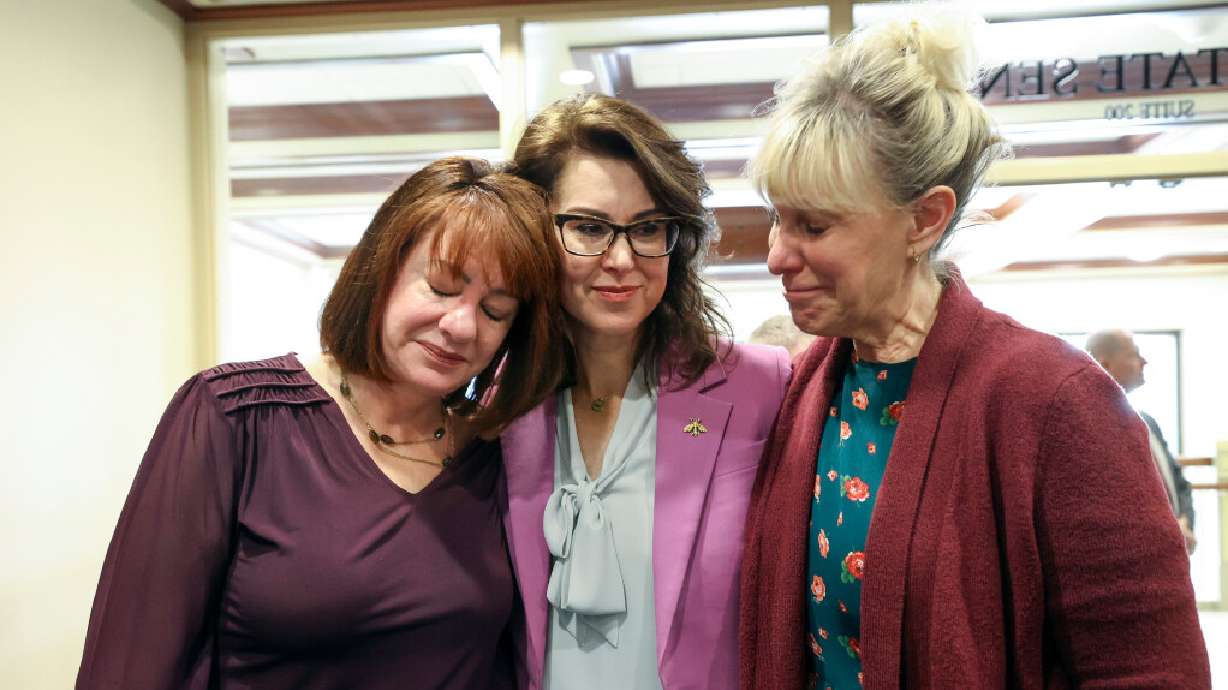 Lt. Gov. Deidre Henderson, center, hugs her aunts Shauna Mayne, left, and Brenda Hulse Burr after SB117 passed a Senate Judiciary, Law Enforcement and Criminal Justice Committee hearing in the Senate Building in Salt Lake City, on Tuesday.