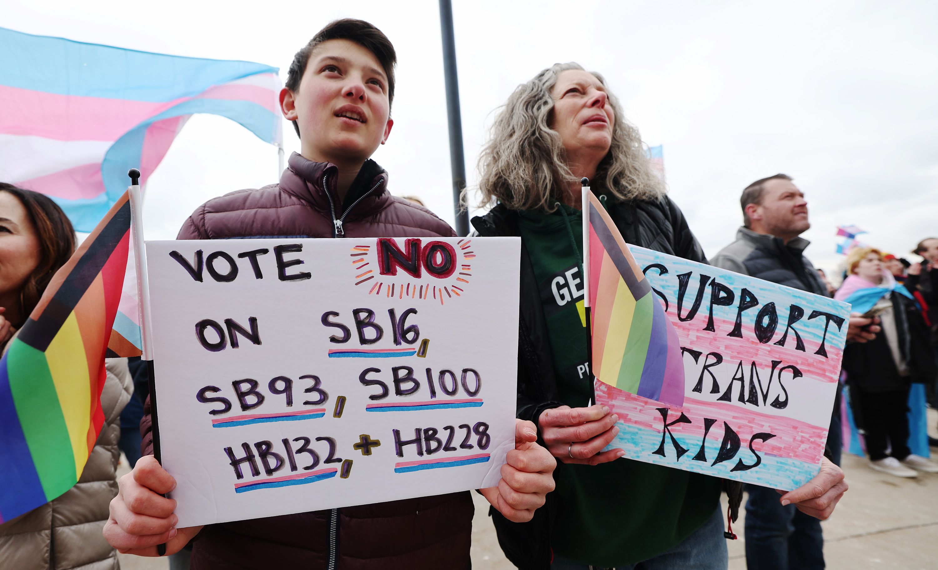 Chloe Taurel and Randy Jo Greenberg join hundreds gathered in support of transgender youth in a rally at the Capitol on Tuesday.