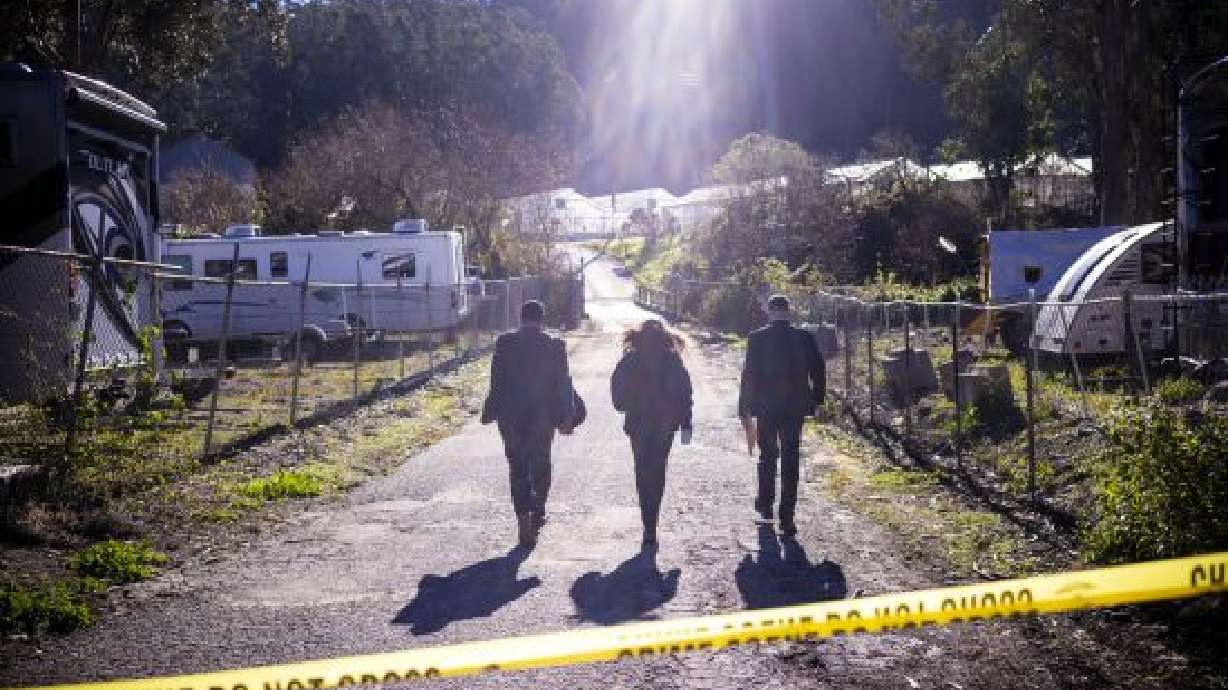FBI agents review the crime scene at Mountain Mushroom Farm, Tuesday after a gunman killed several people at two agricultural businesses in Half Moon Bay, Calif. Officers arrested a suspect in Monday’s shootings, 67-year-old Chunli Zhao, the local sheriff said.