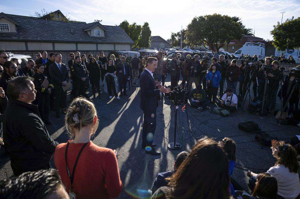 Gov. Gavin Newsom speaks to victims' families, local leaders and community members impacted by the fatal shootings a day earlier, at the I.D.E.S. Portuguese Hall in Half Moon Bay, Calif., Tuesday.