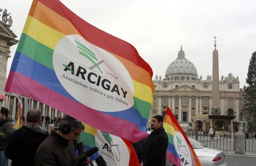 Italian Arcigay gay rights association activists hold banners and flags during a demonstration in front of The Vatican, in this Jan. 13, 2009. Pope Francis said bishops in particular need to undergo a process of change to recognize the dignity of everyone.