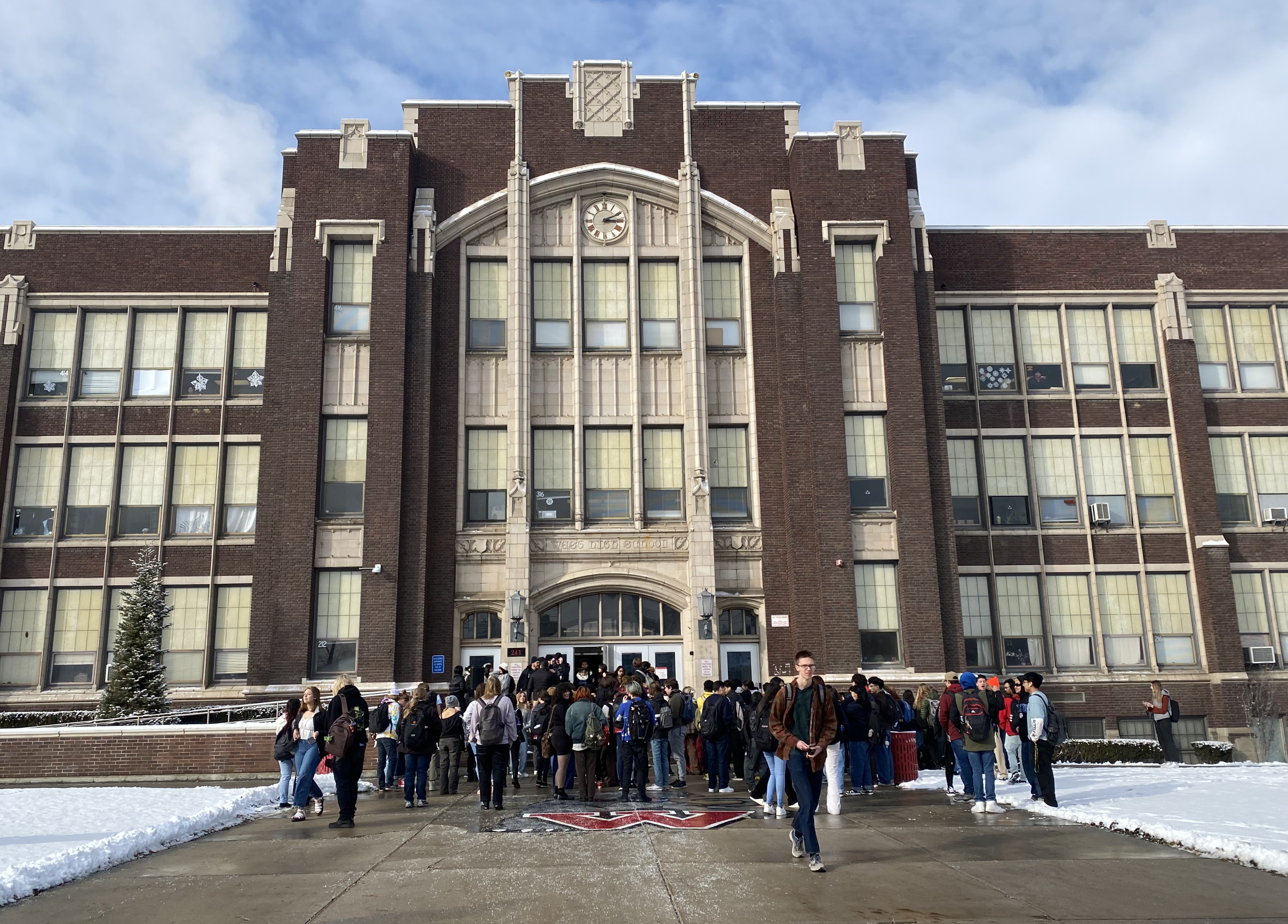 West High School students walk out of class on Wednesday in protest of the school administration's policies for handling reports of sexual harassment and assault.
