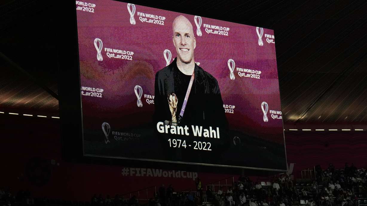 FILE - A tribute to journalist Grant Wahl is displayed on a screen before the World Cup quarterfinal soccer match between England and France, at the Al Bayt Stadium in Al Khor, Qatar, on Dec. 10, 2022. The late Grant Wahl will be honored with this year's Colin Jose Media Award, given to journalists who made long-term contributions to soccer in the United States.Wahl died at age 49 on Dec. 10 after collapsing while covering the World Cup quarterfinal between Argentina and the Netherlands at Lusail, Qatar.