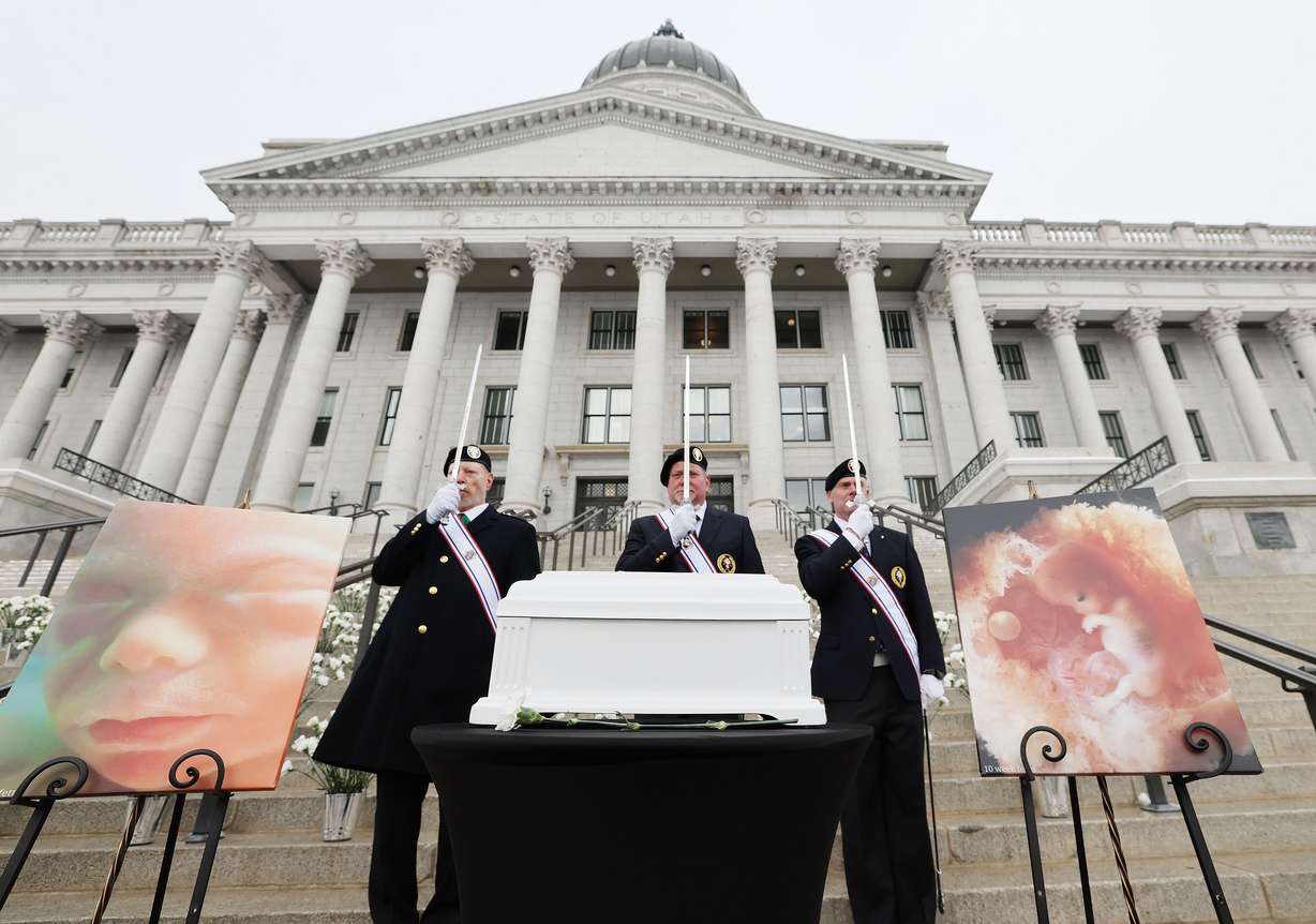 The Knights of Columbus honor guard stands by a symbolic casket during a Pro-Life Utah memorial service at the Capitol in Salt Lake City on Wednesday, Jan. 25, 2023, to honor the lives of 1,746 unborn babies that were aborted in Utah in 2022.