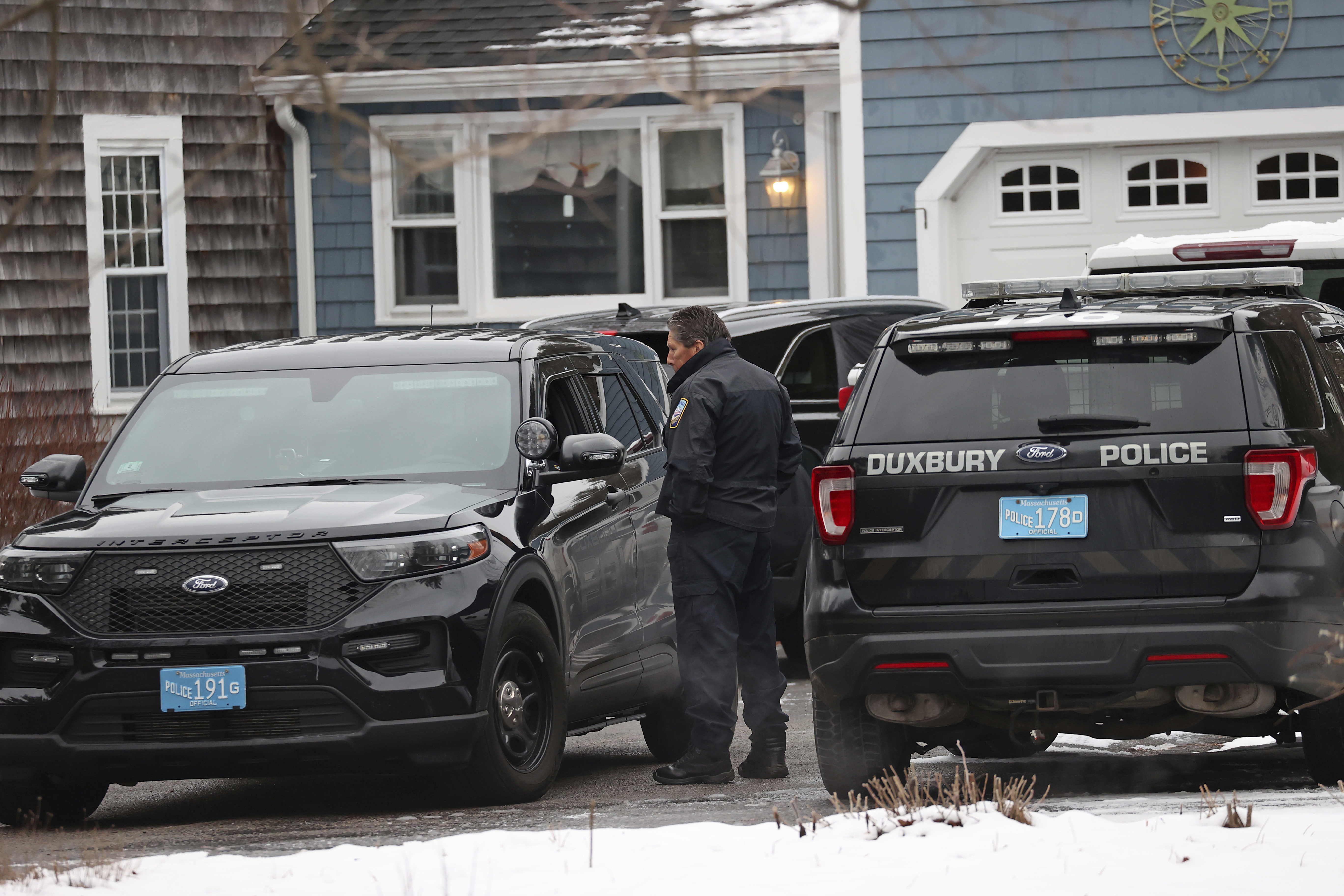 Duxbury police work at the scene where two children were found dead and an infant injured, Wednesday in Duxbury, Mass. A 32-year-old mother in Massachusetts is expected to be charged in the killing of her two children and the injuring of her infant son, officials say.
