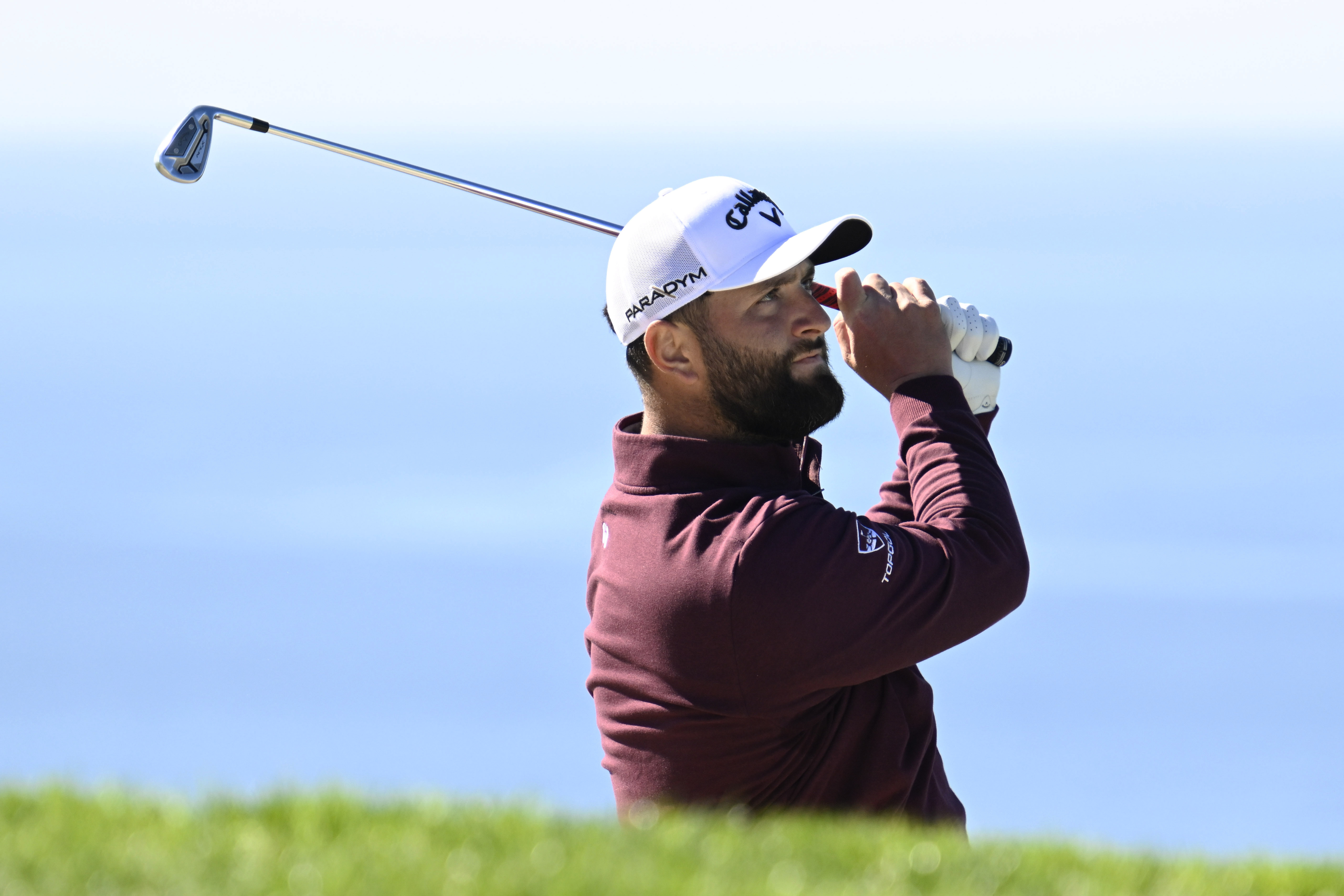 Jon Rahm, of Spain, watches his shot from a bunker on the fifth hole of the South Course at Torrey Pines during the first round of the Farmers Insurance Open golf tournament Wednesday, Jan. 25, 2023, in San Diego. 