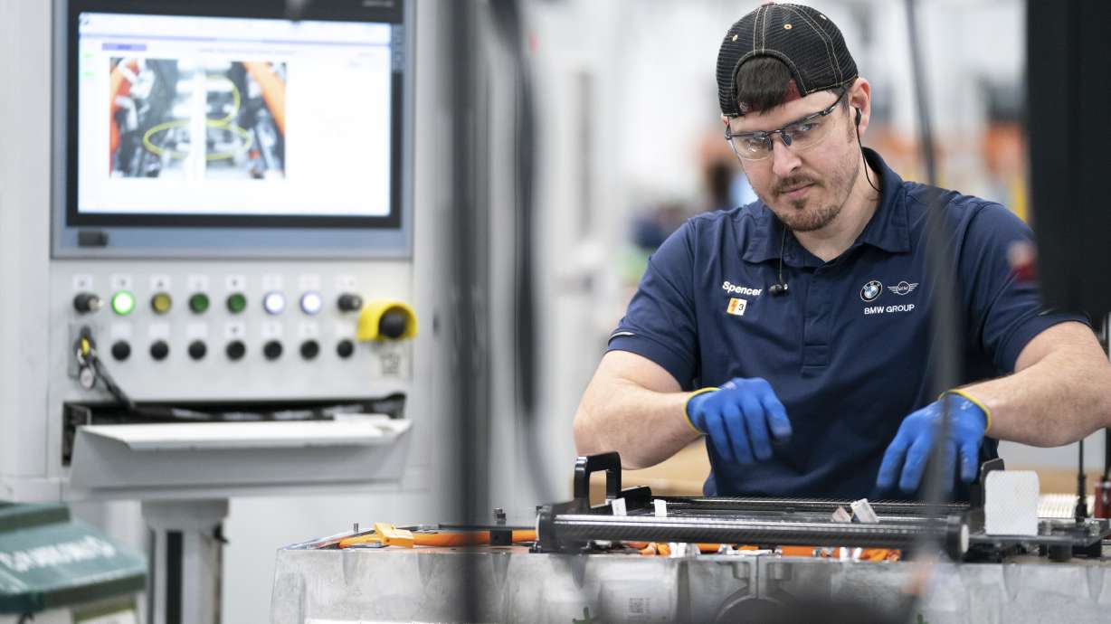 An employee works in the battery assembly hall at the BMW Spartanburg plant in Greer, S.C., Oct. 19, 2022. On Thursday, the Commerce Department said the U.S. economy expanded at a 2.9% annual pace from October through December.