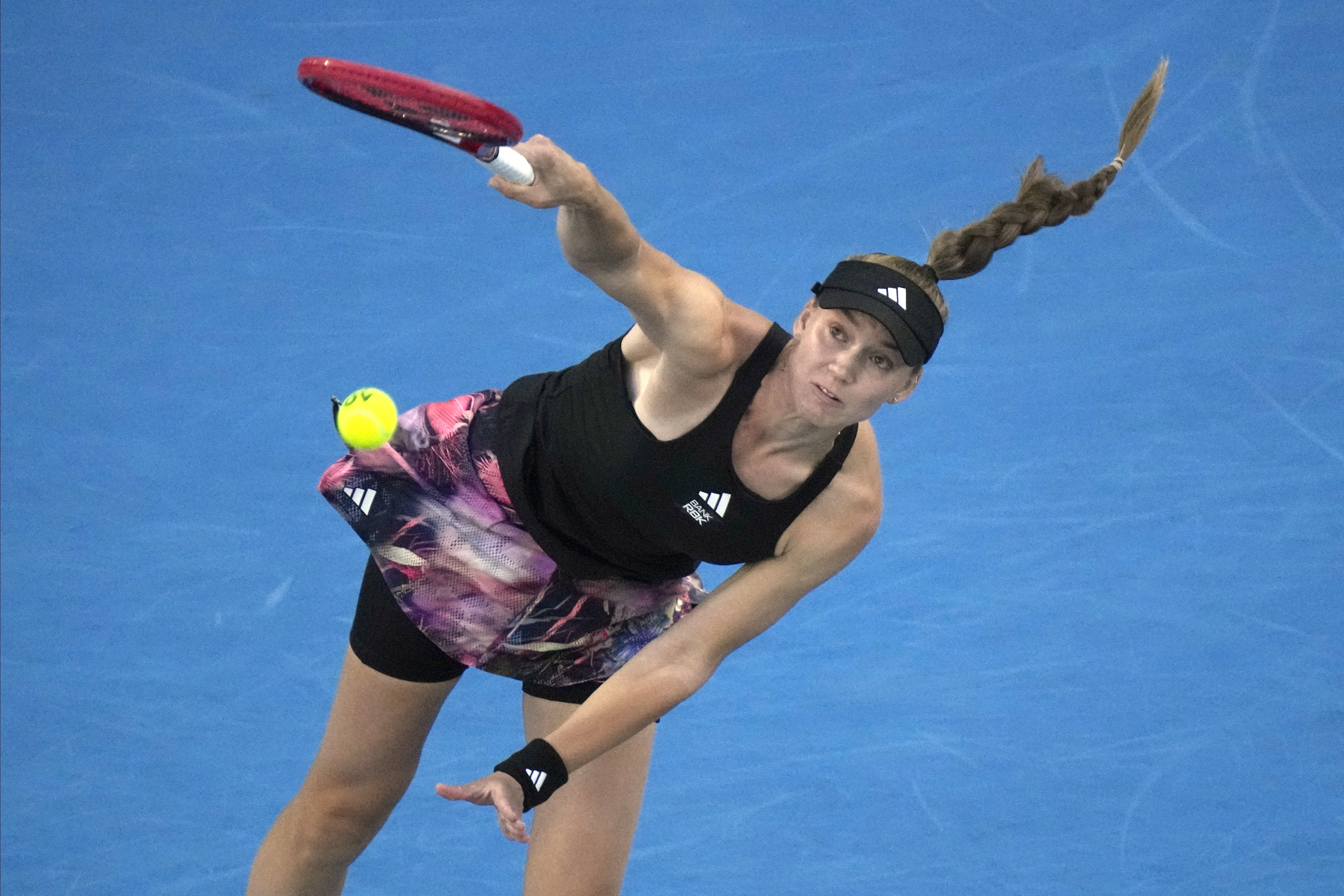 Elena Rybakina of Kazakhstan serves to Victoria Azarenka of Belarus during their semifinal match at the Australian Open tennis championship in Melbourne, Australia, Thursday, Jan. 26, 2023. 