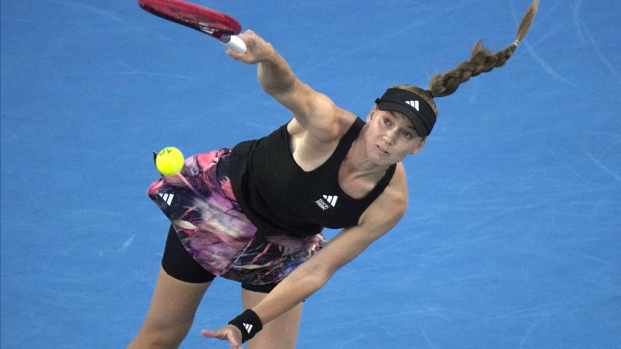 Elena Rybakina of Kazakhstan serves to Victoria Azarenka of Belarus during their semifinal match at the Australian Open tennis championship in Melbourne, Australia, Thursday, Jan. 26, 2023.