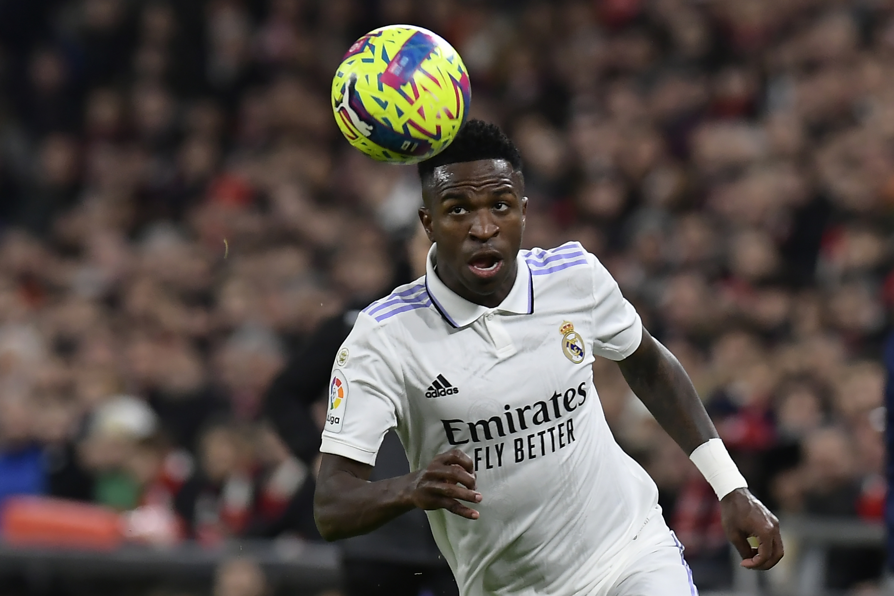 Real Madrid's Vinicius Junior controls the ball during the Spanish La Liga soccer match between Athletic Club Bilbao and Real Madrid at the San Mames stadium in Bilbao, Spain, Sunday, Jan. 22, 2023. 